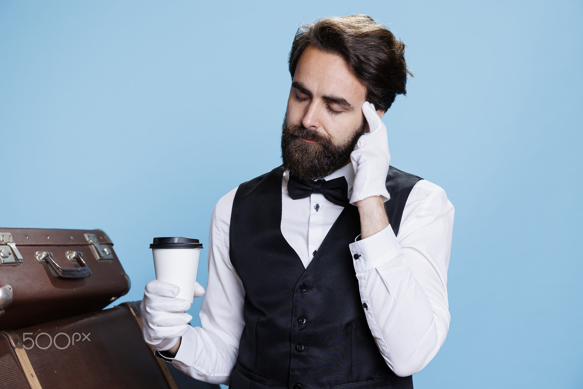 Steward thinking and drinking coffee