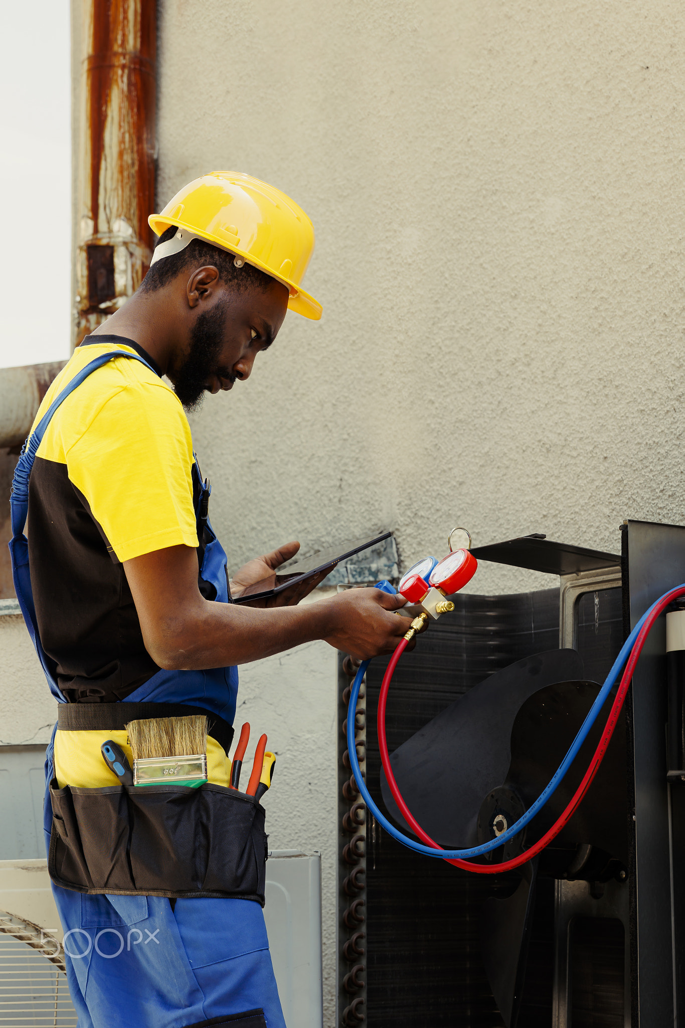 Wireman repairing noisy air conditioner