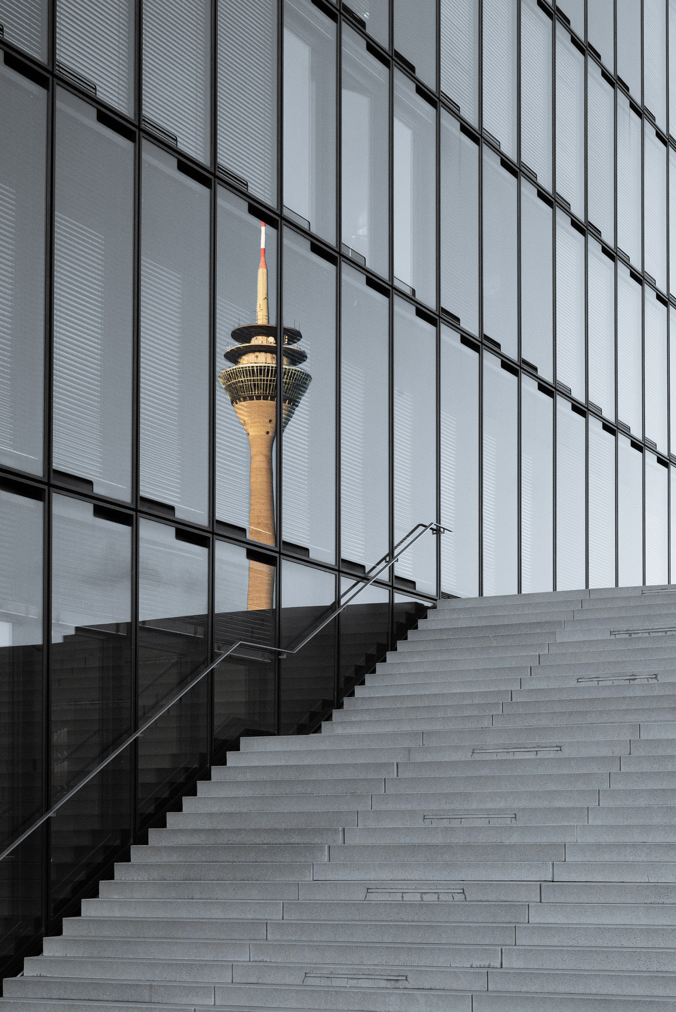 Low angle view of staircase against sky TV tower reflection