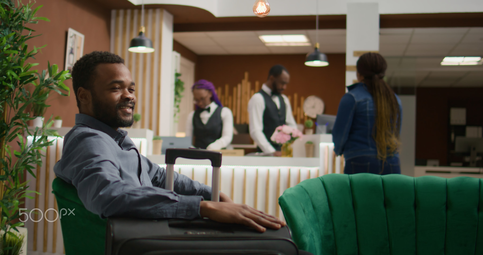 African american guest sit in lobby