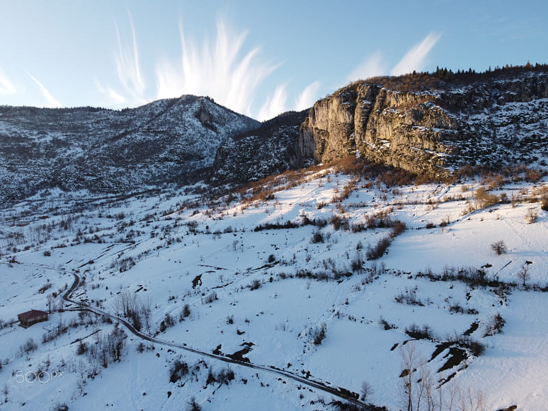 Scenic view of snow covered mountains against sky by NECMETT?N SOBUTAY on 500px.com