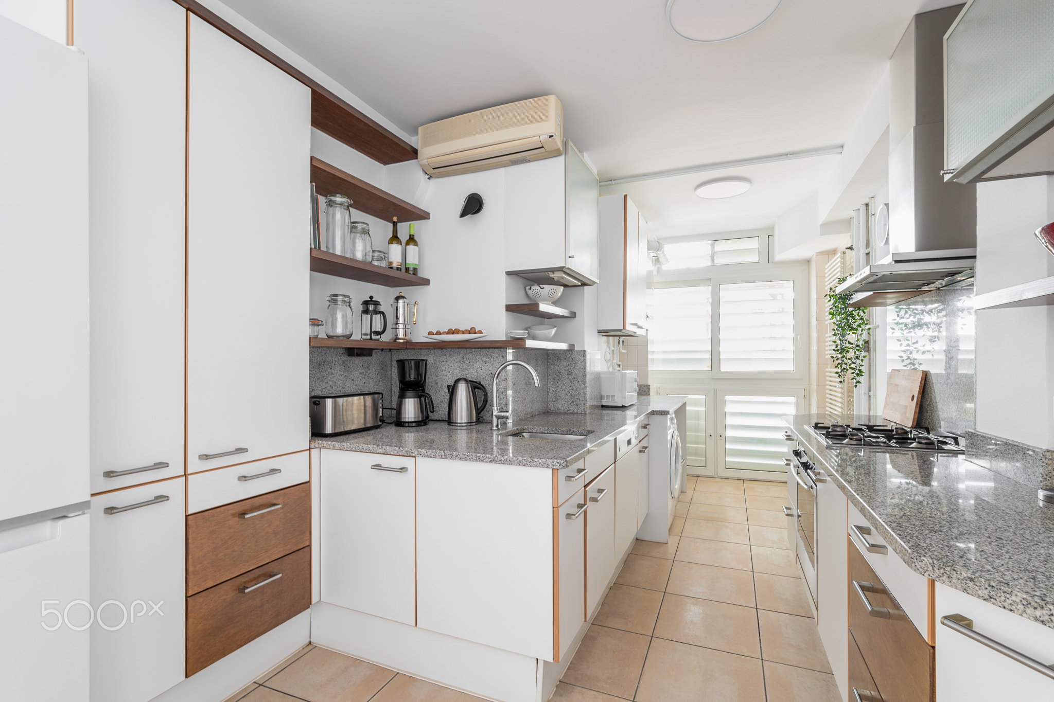 Kitchen unit with different cabinets and cooking appliances