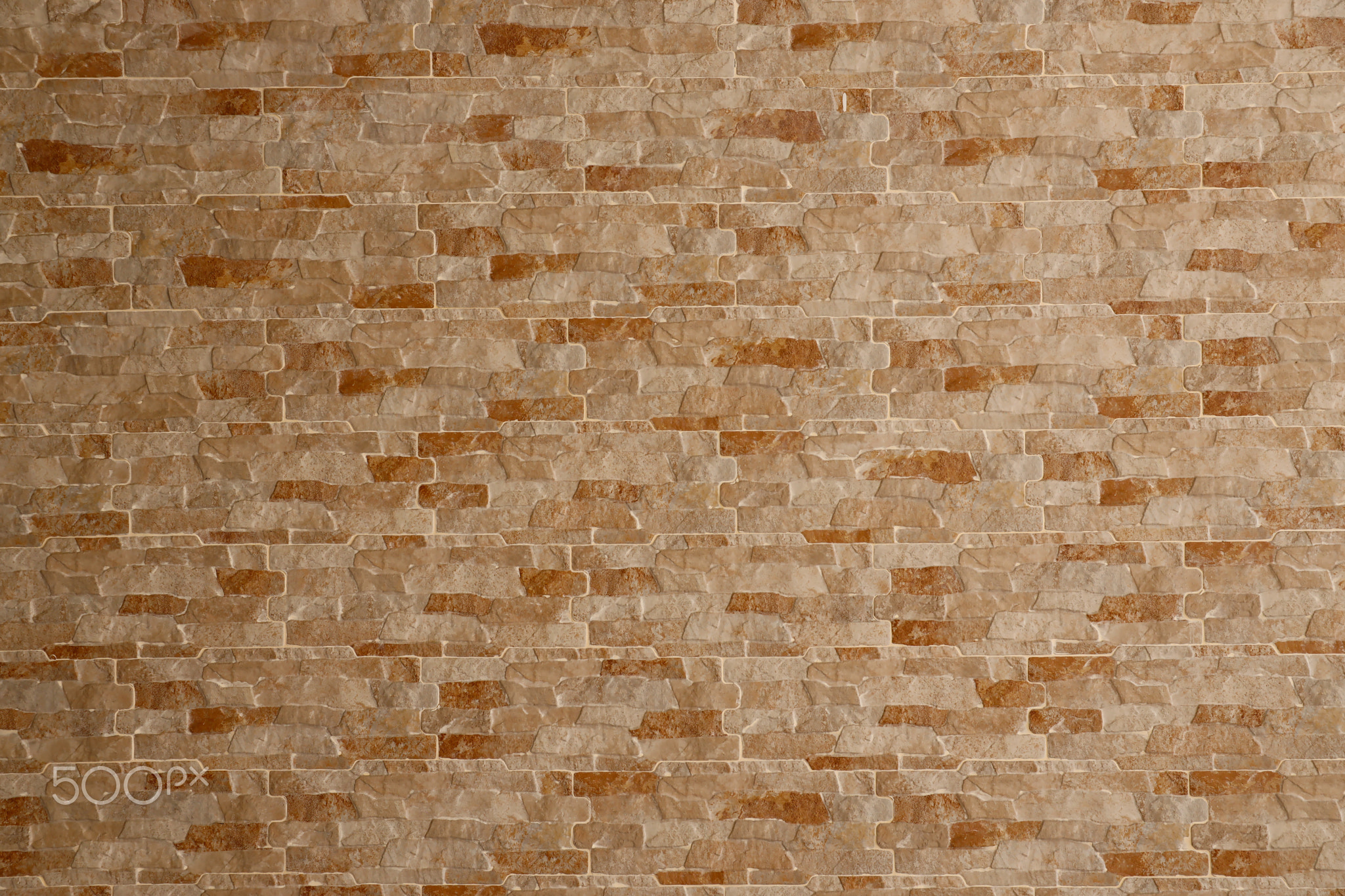 Cladding wall made of stoneware panels with multi colored bricks