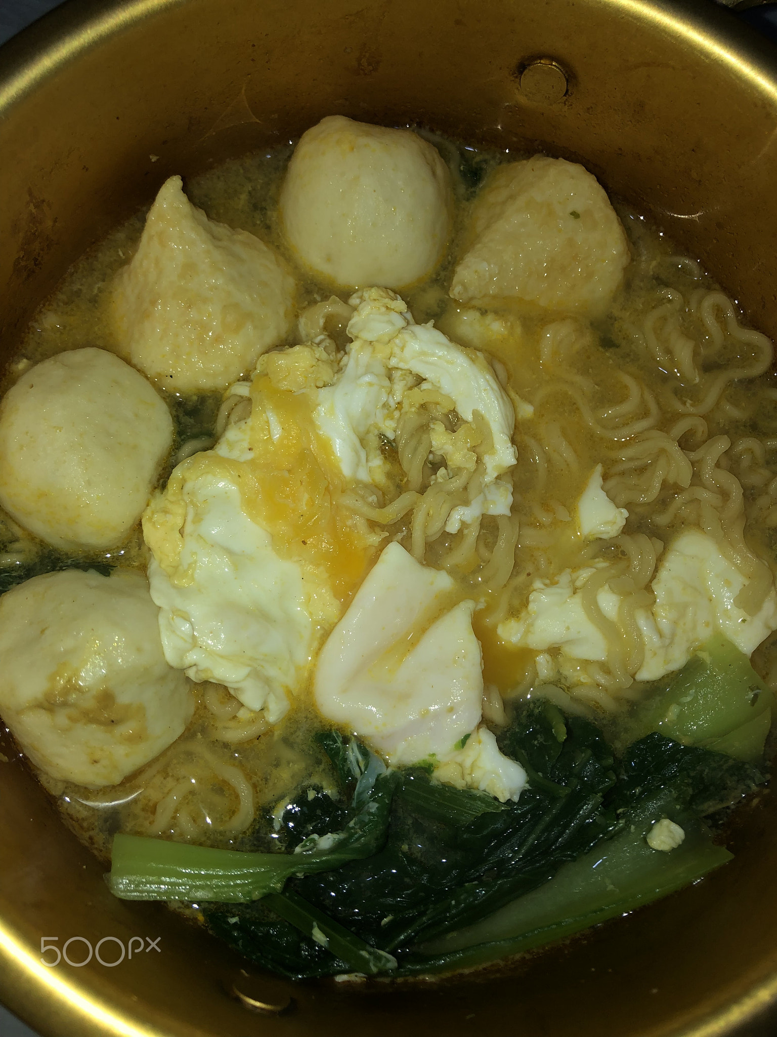 Noodle soup with egg, mustard greens and fish ball