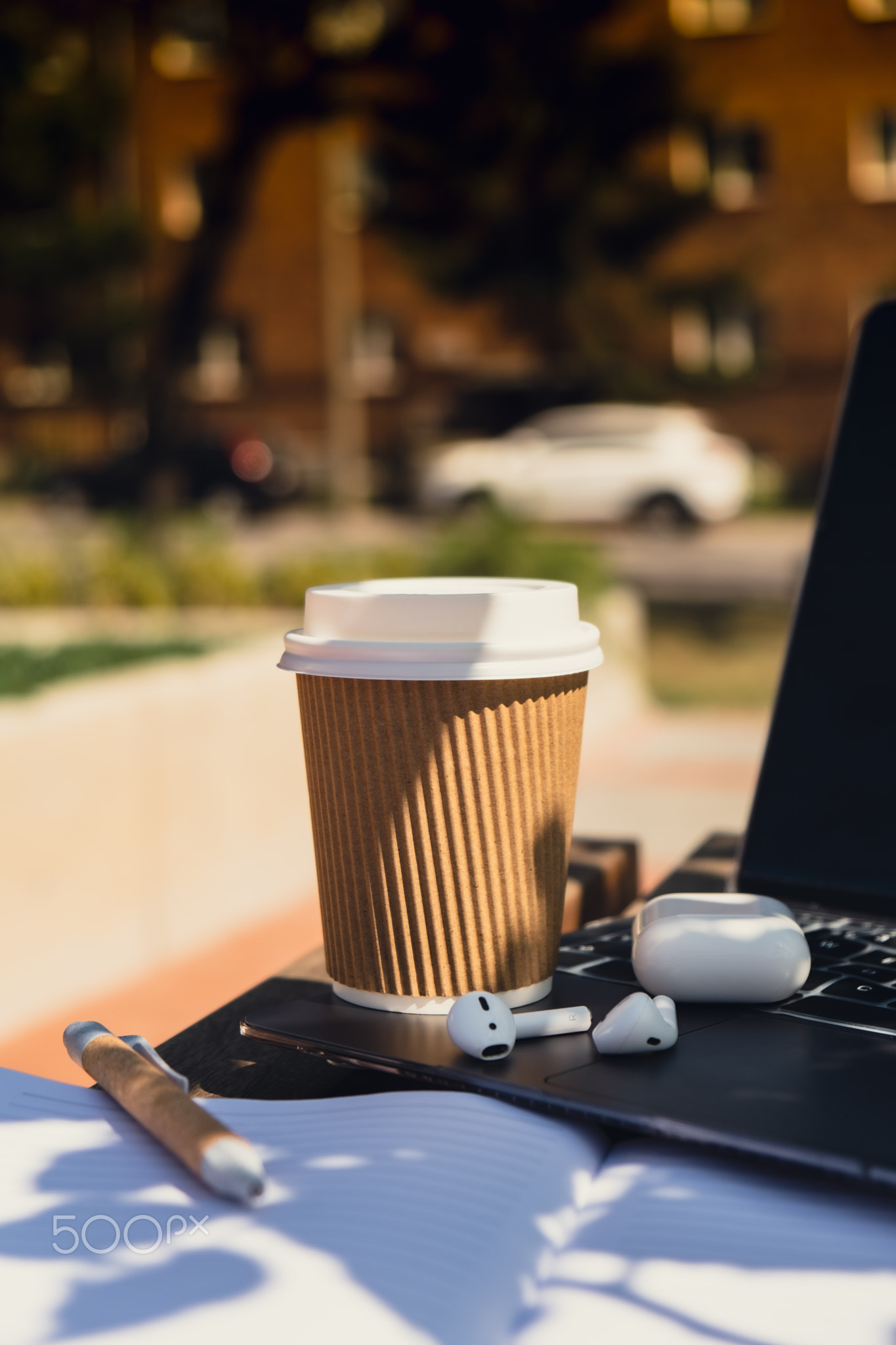 Take away coffee in craft recycling paper cup with paper notebook
