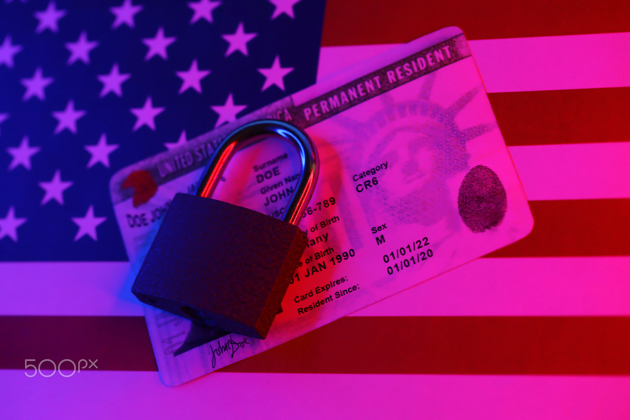 Permanent resident green card for US DV-lottery with small padlock on US flag