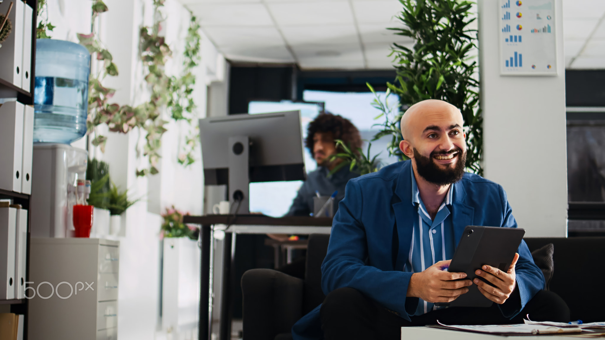 Employee comparing data on tablet
