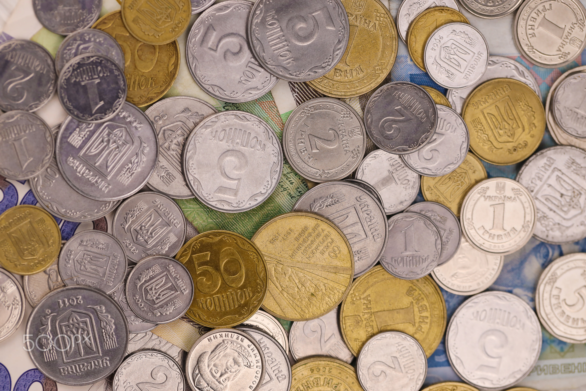 Ukrainian kopiika coins close up. Big amount of ukrainian money on table. Business and stock concept