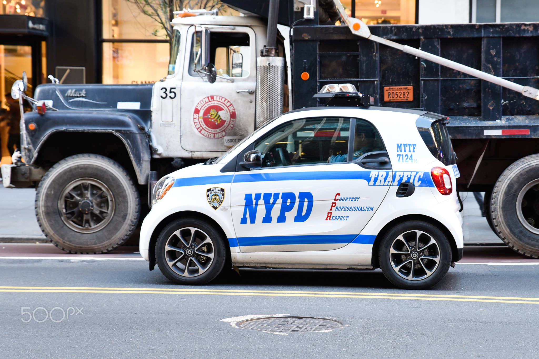 New York NYPD Police car with sirens at day on street