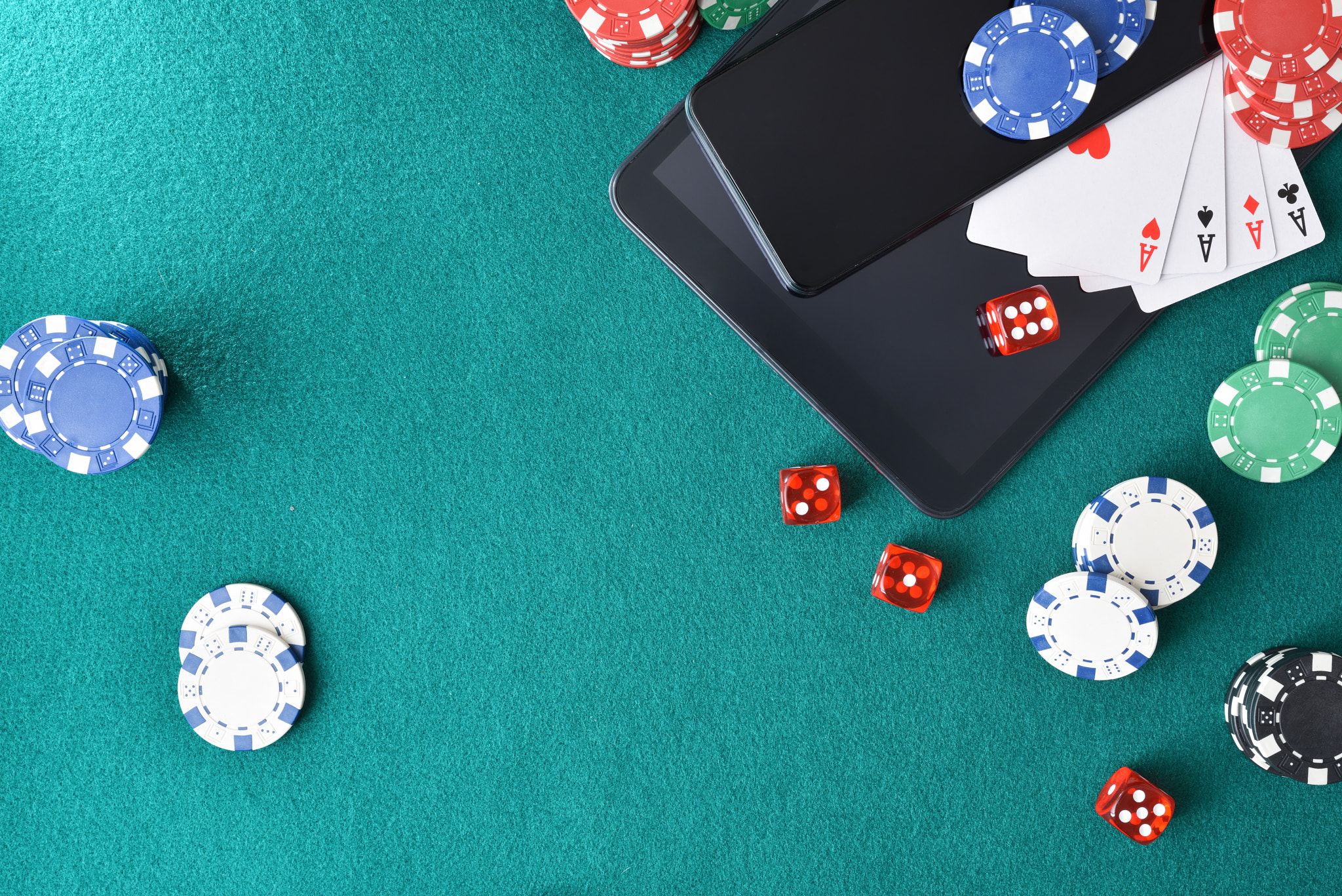 Online casino games with mobile devices on mat with objects