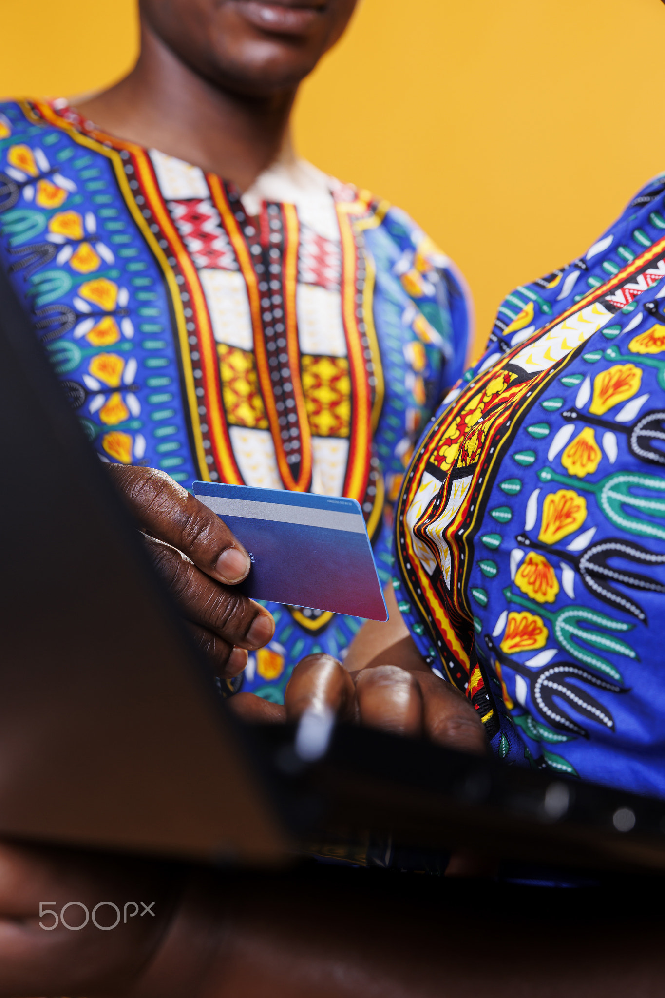 Couple paying for purchase on laptop