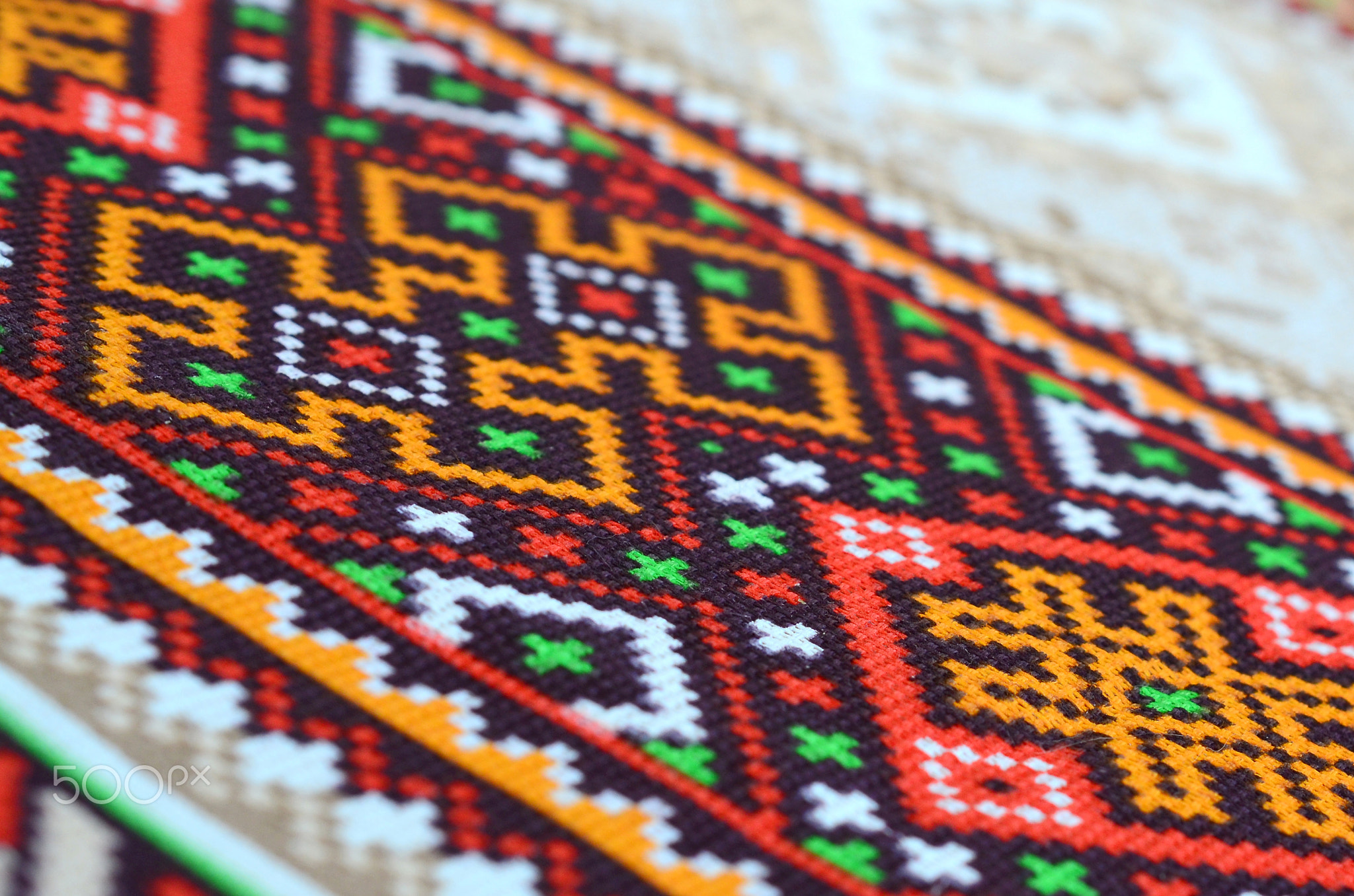 Traditional Ukrainian folk art knitted embroidery pattern on textile fabric