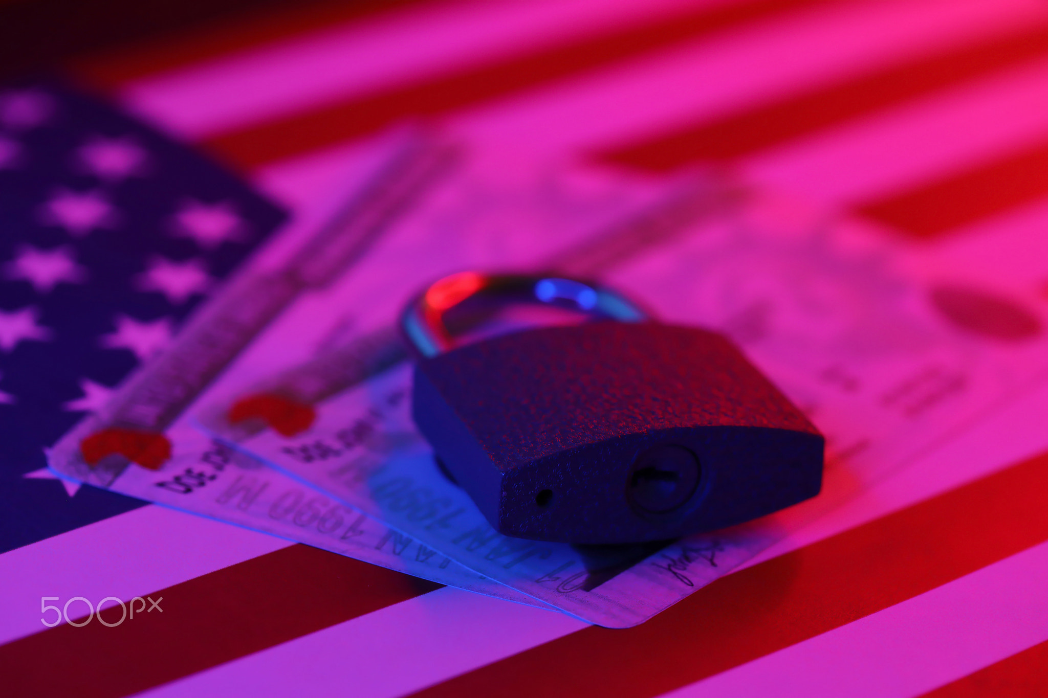 Permanent resident green card for US DV-lottery with small padlock on US flag