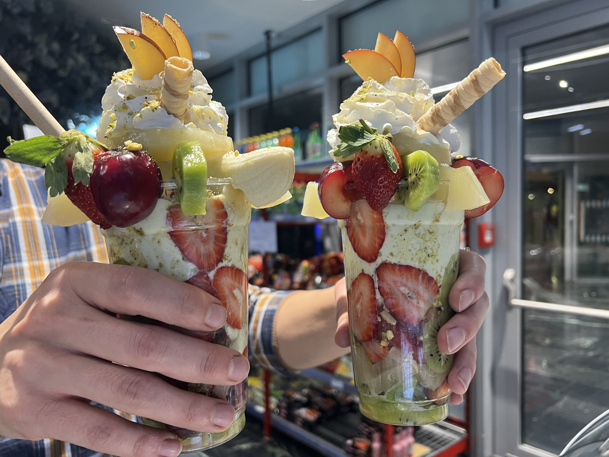 Cropped hands holding ice cream cone