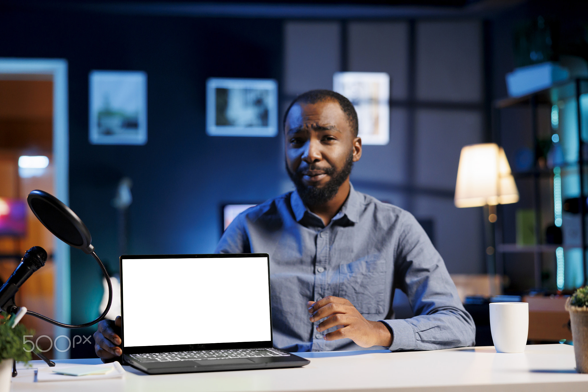Tech expert presents mockup laptop