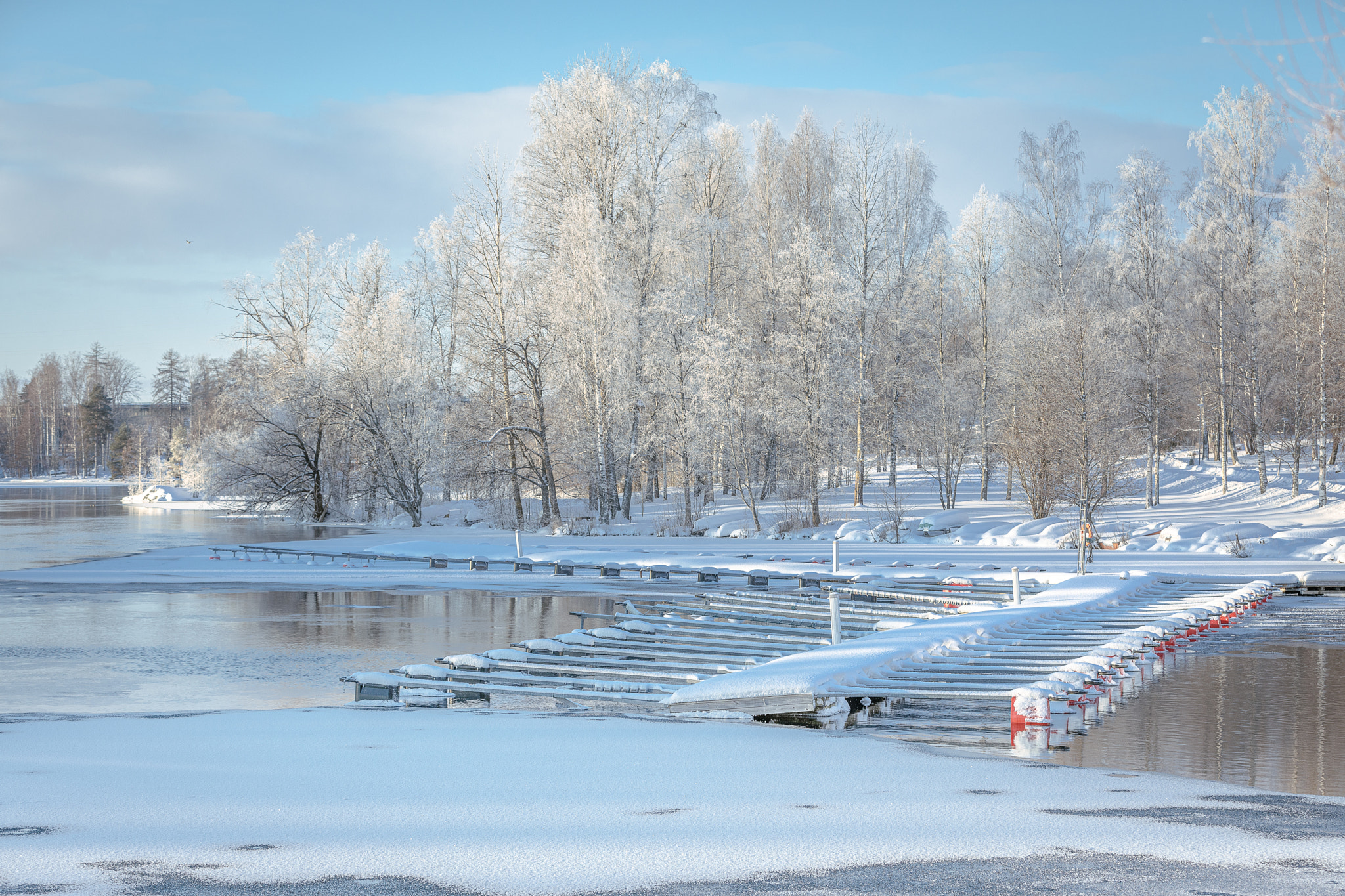 Scenic view of frozen lake against sky during winter