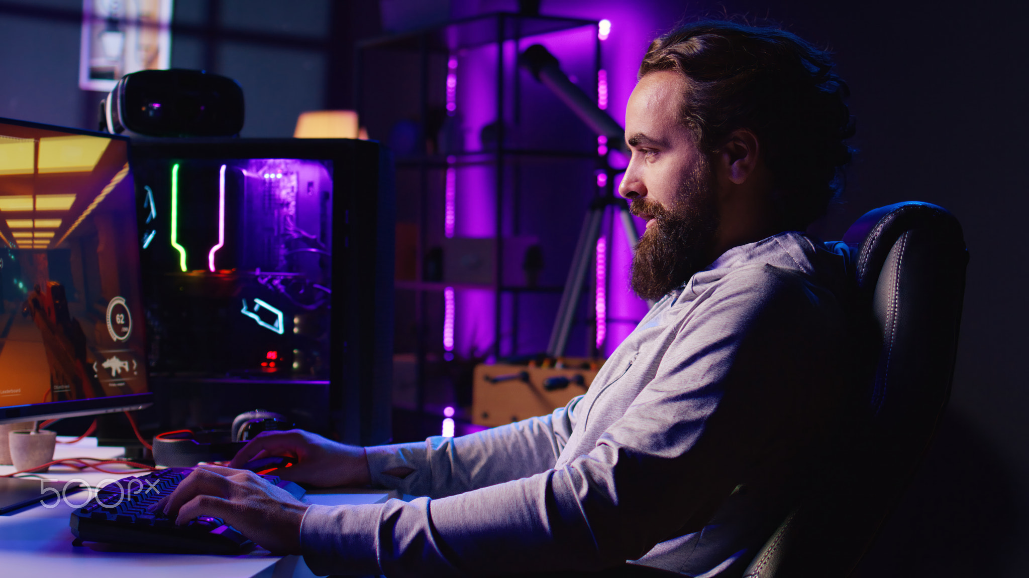 Gamer playing science fiction first person shooter game, fighting