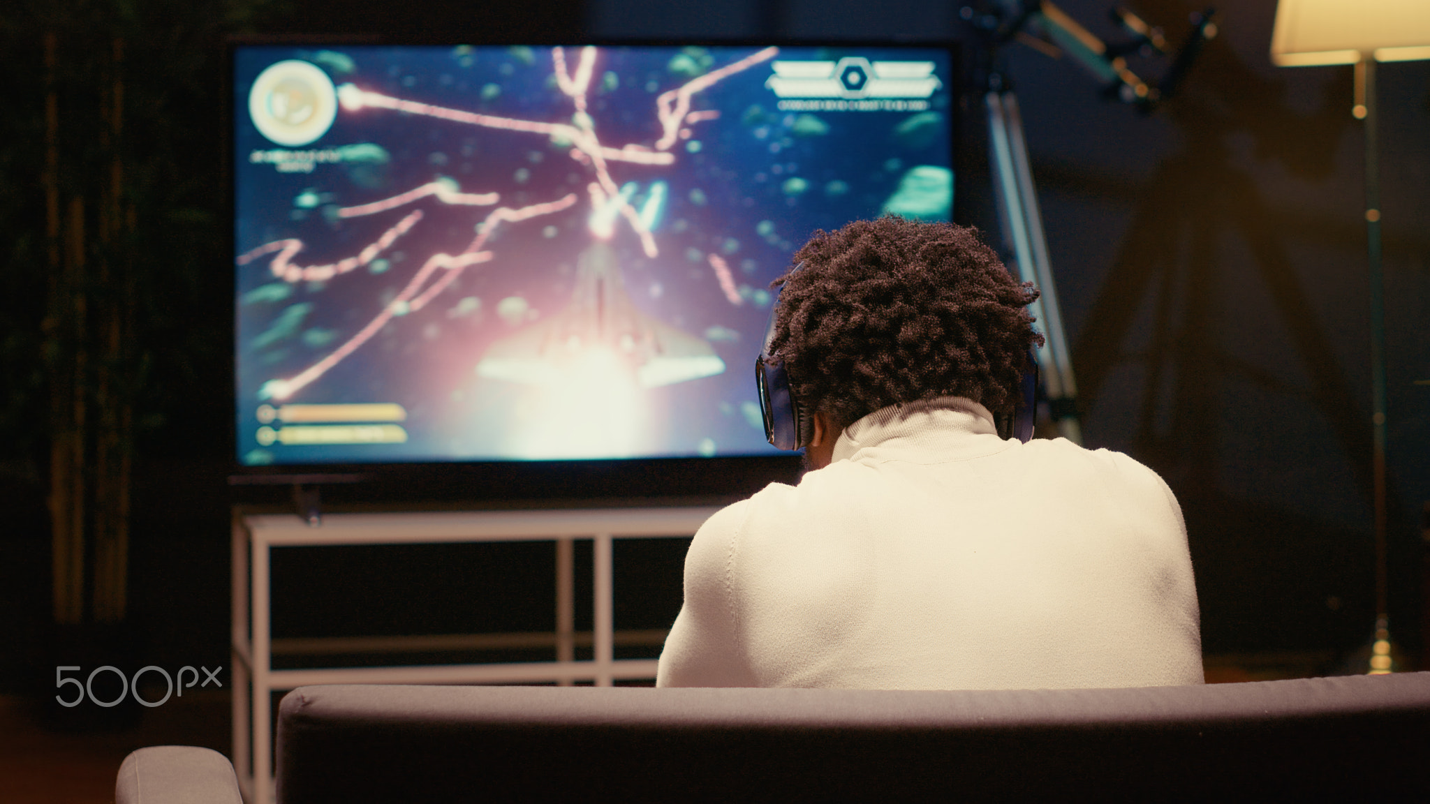 Gamer receiving game over screen on television set, getting his