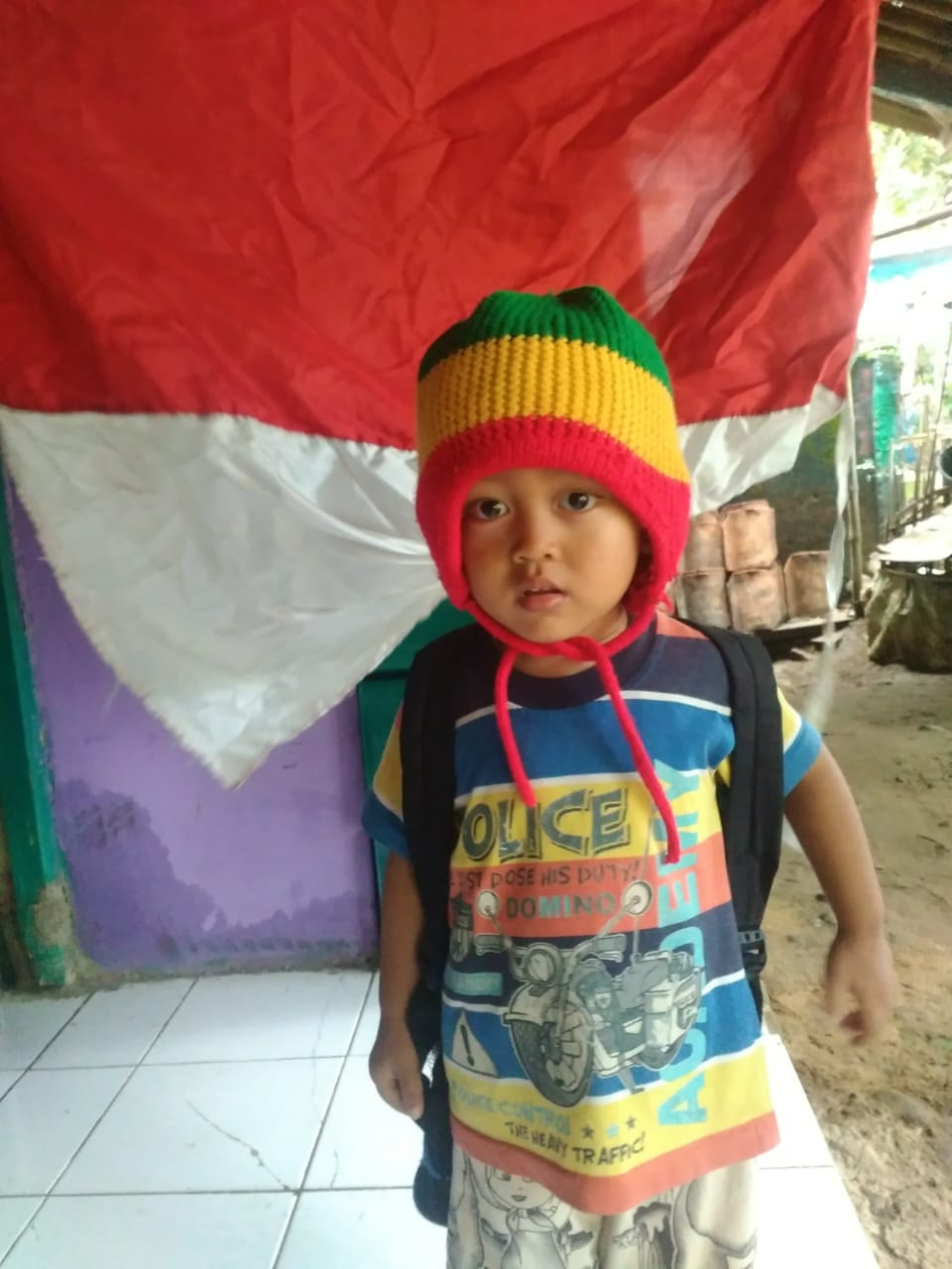 photo of my son in front of the flag