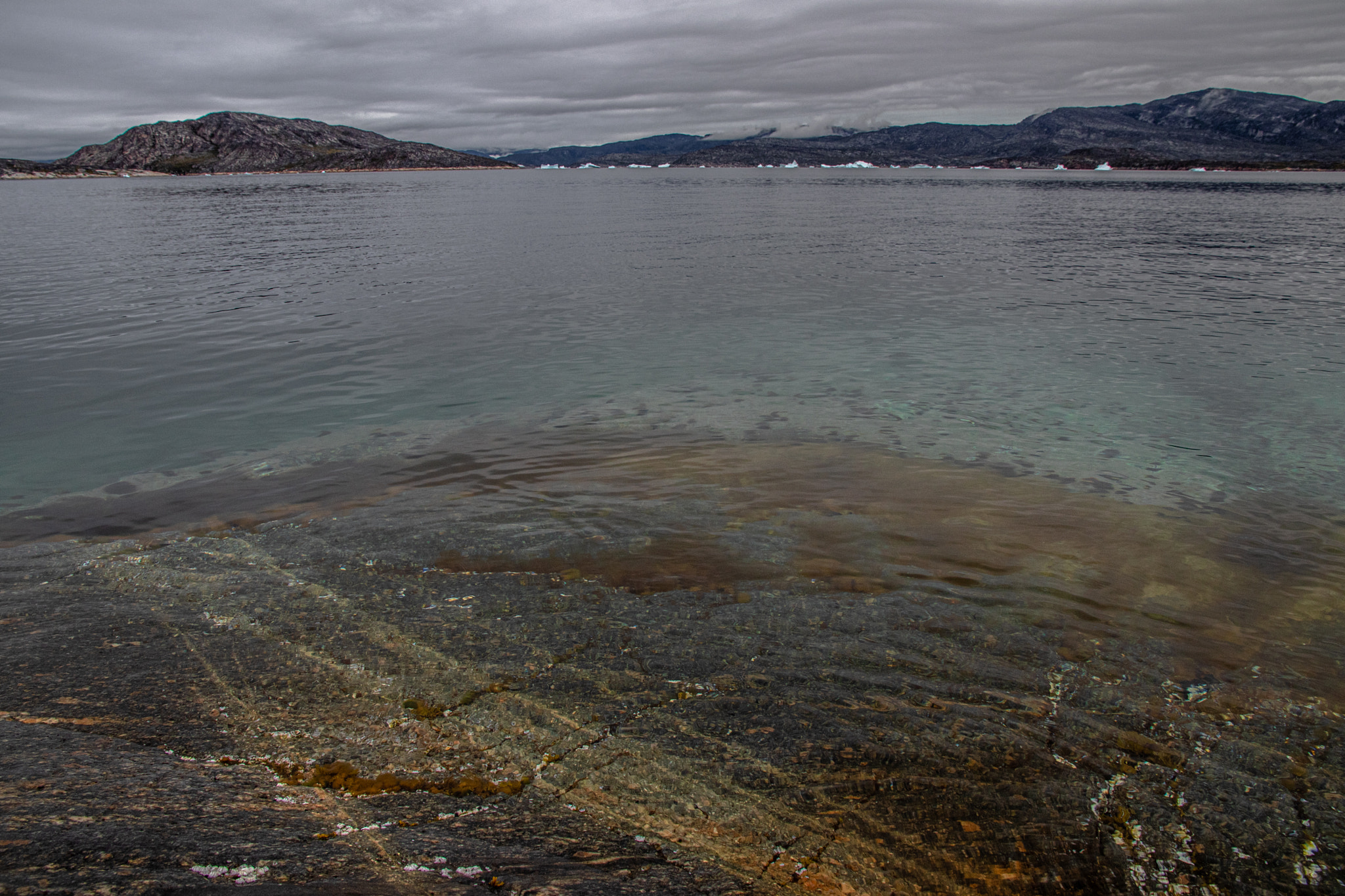 Bay seen from rocky beach