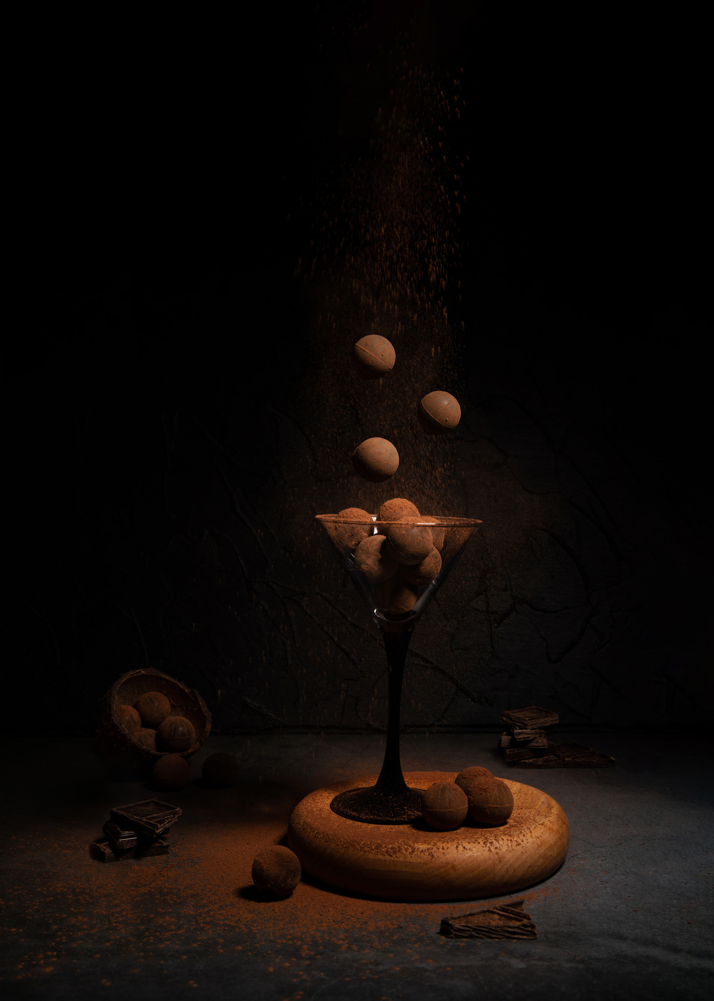 levitation of sweets in a glass glass on a dark background with cocoa and chocolate. Letayuza food f