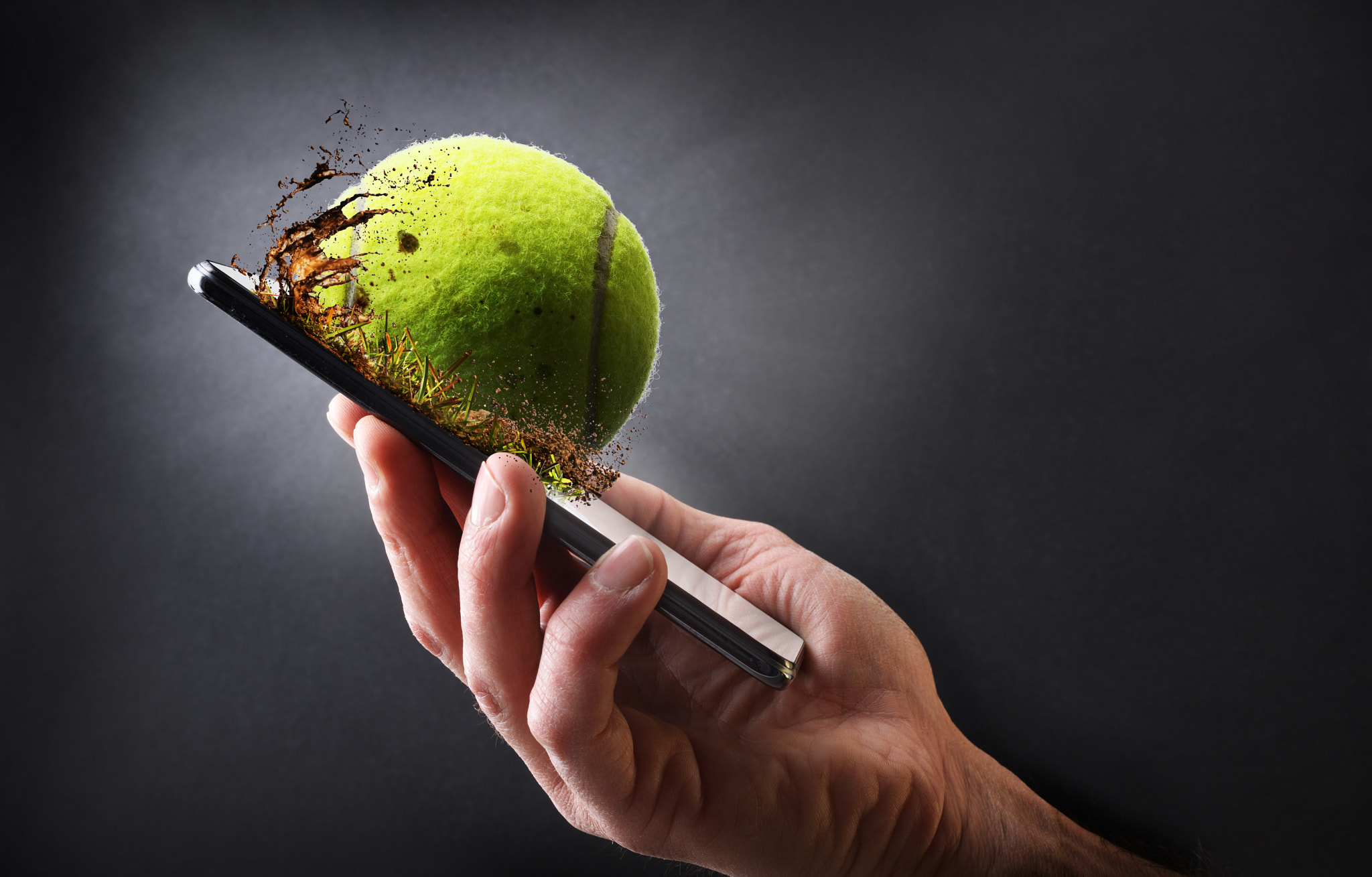 Concept watching tennis online with hand with mobile and ball