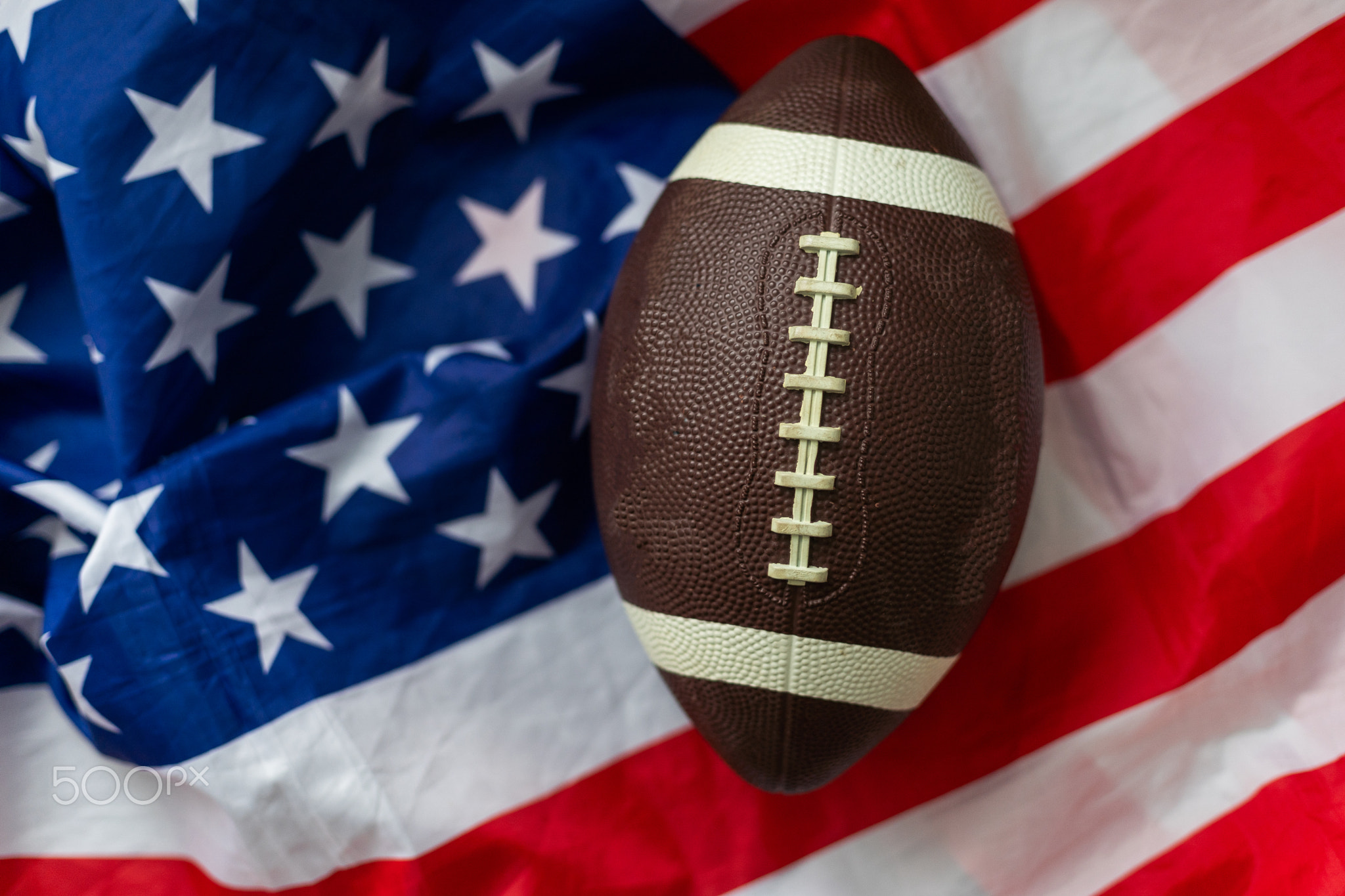 American football ball. American football with American flag. dark