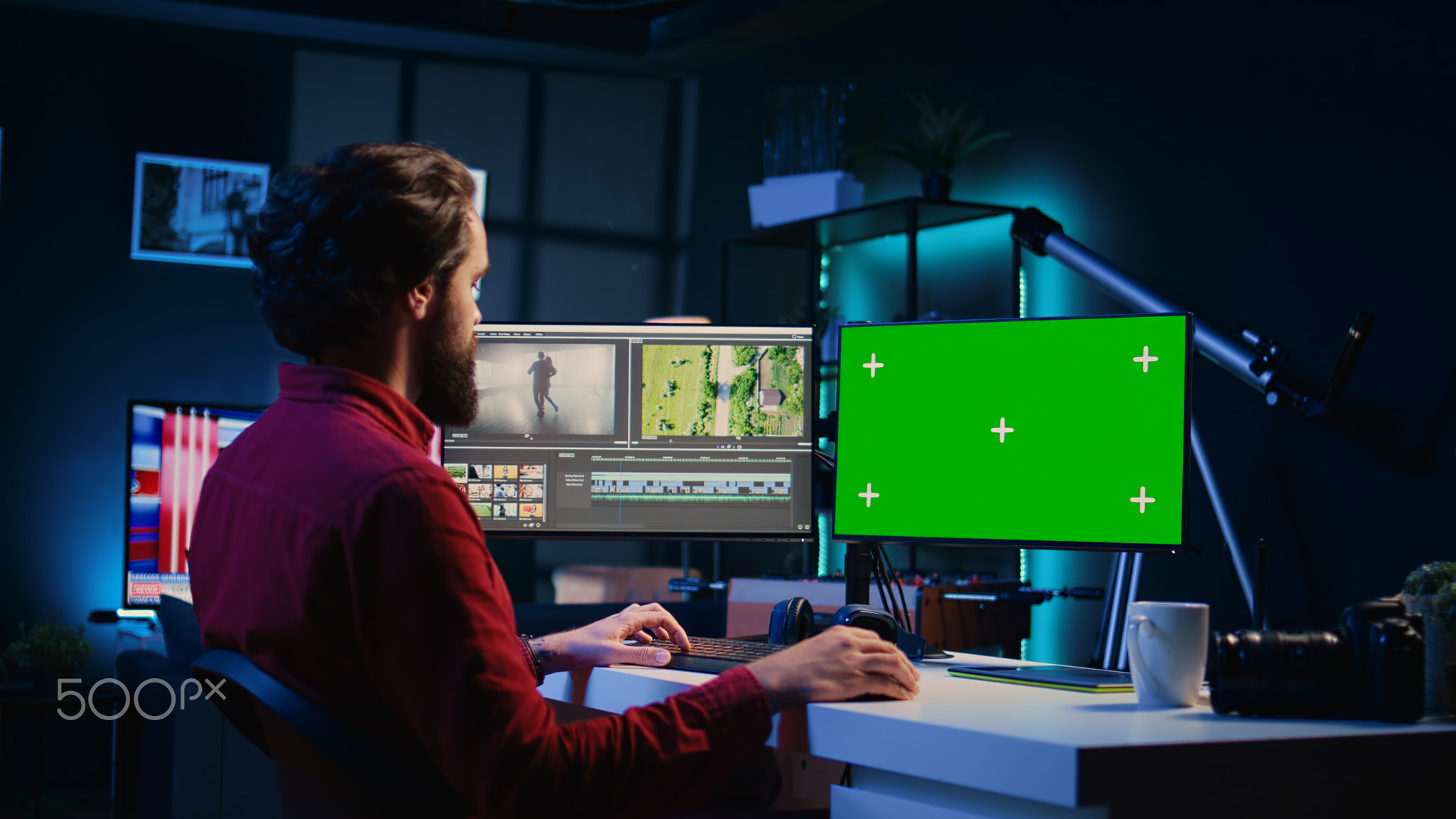 Video editor using editing software on green screen monitor to upgrade