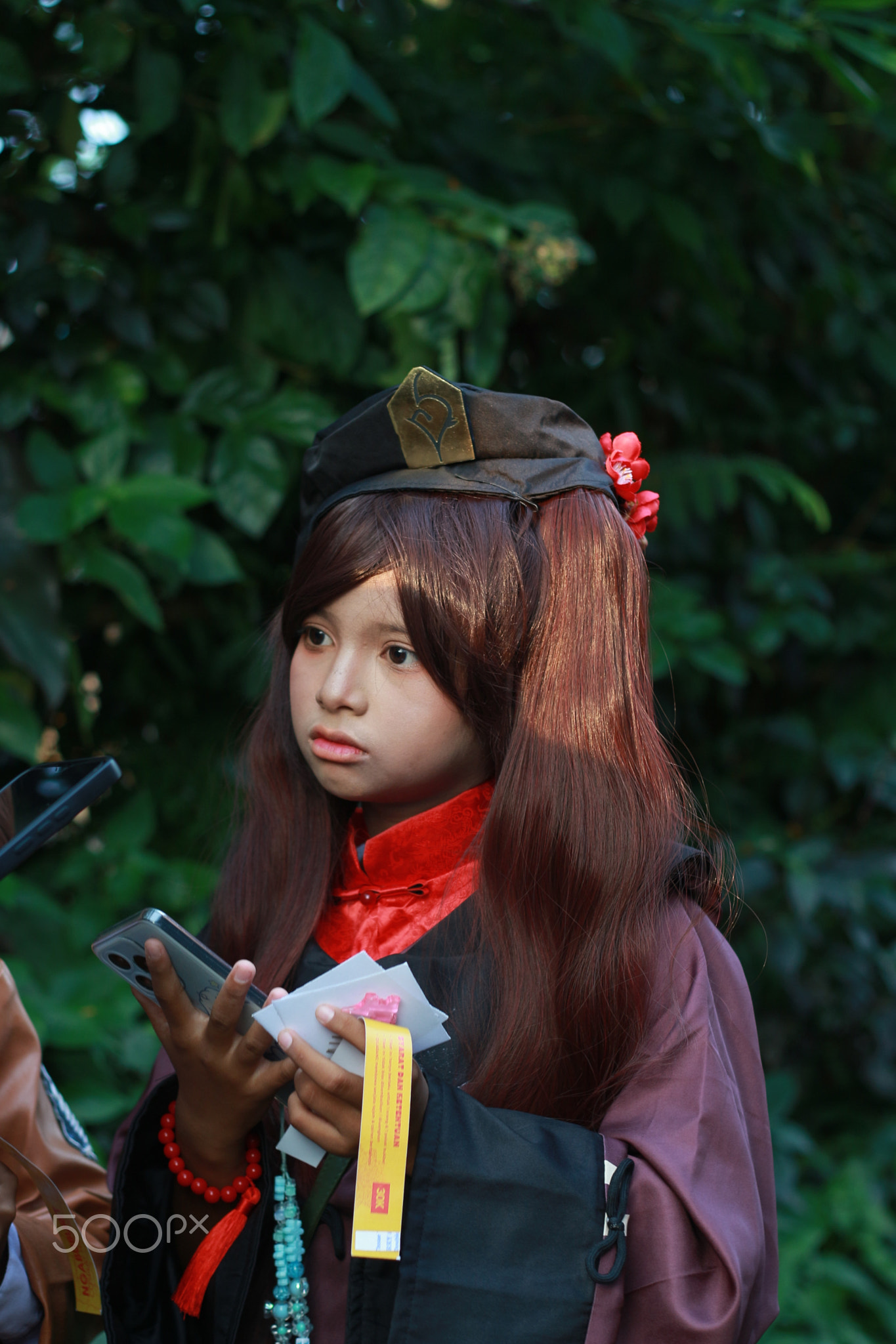 A Girl Cosplay Hu Tao Genshin Impact