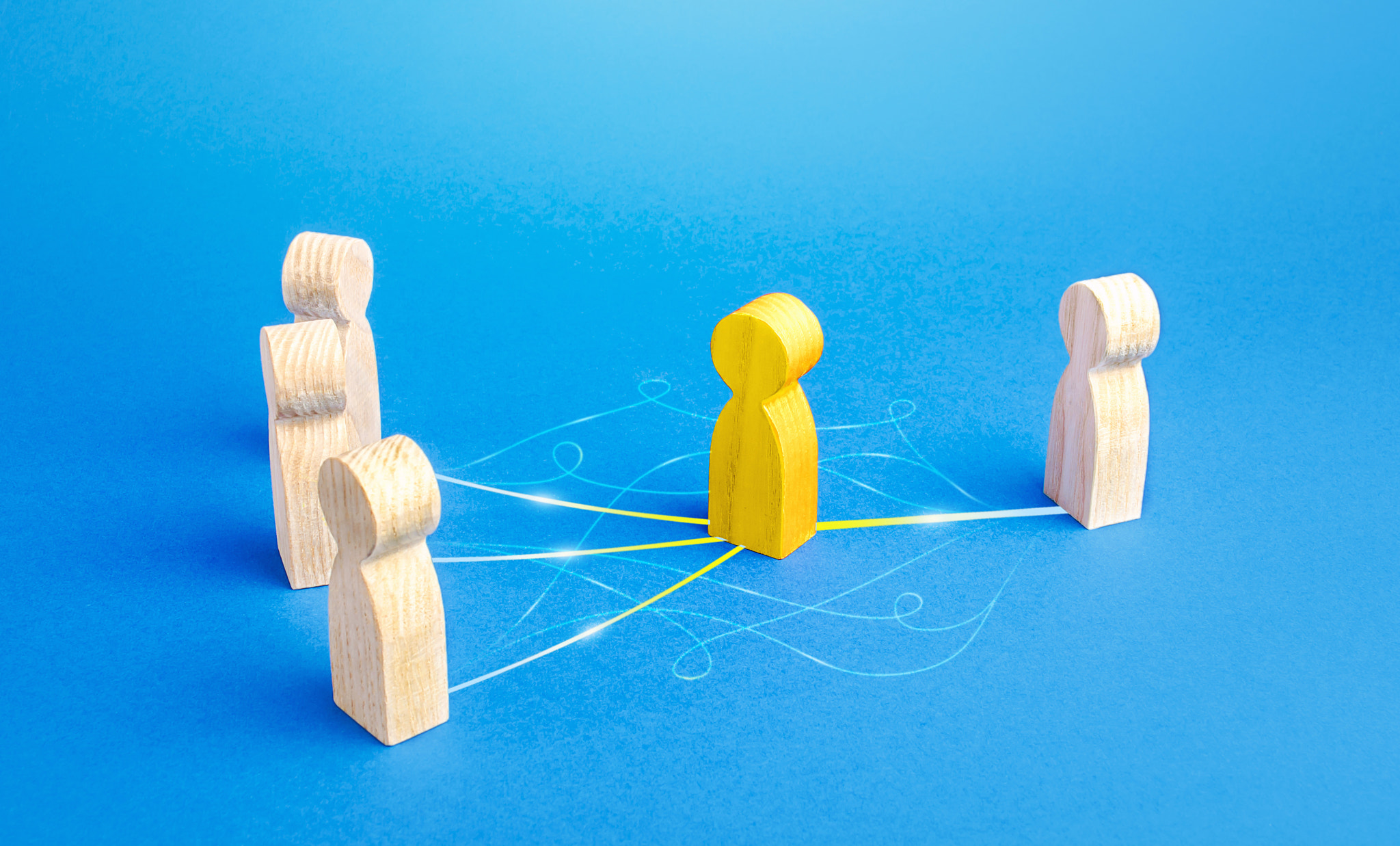 The yellow person acts as mediator between people. Bridging parties, communication. Easy negotiation