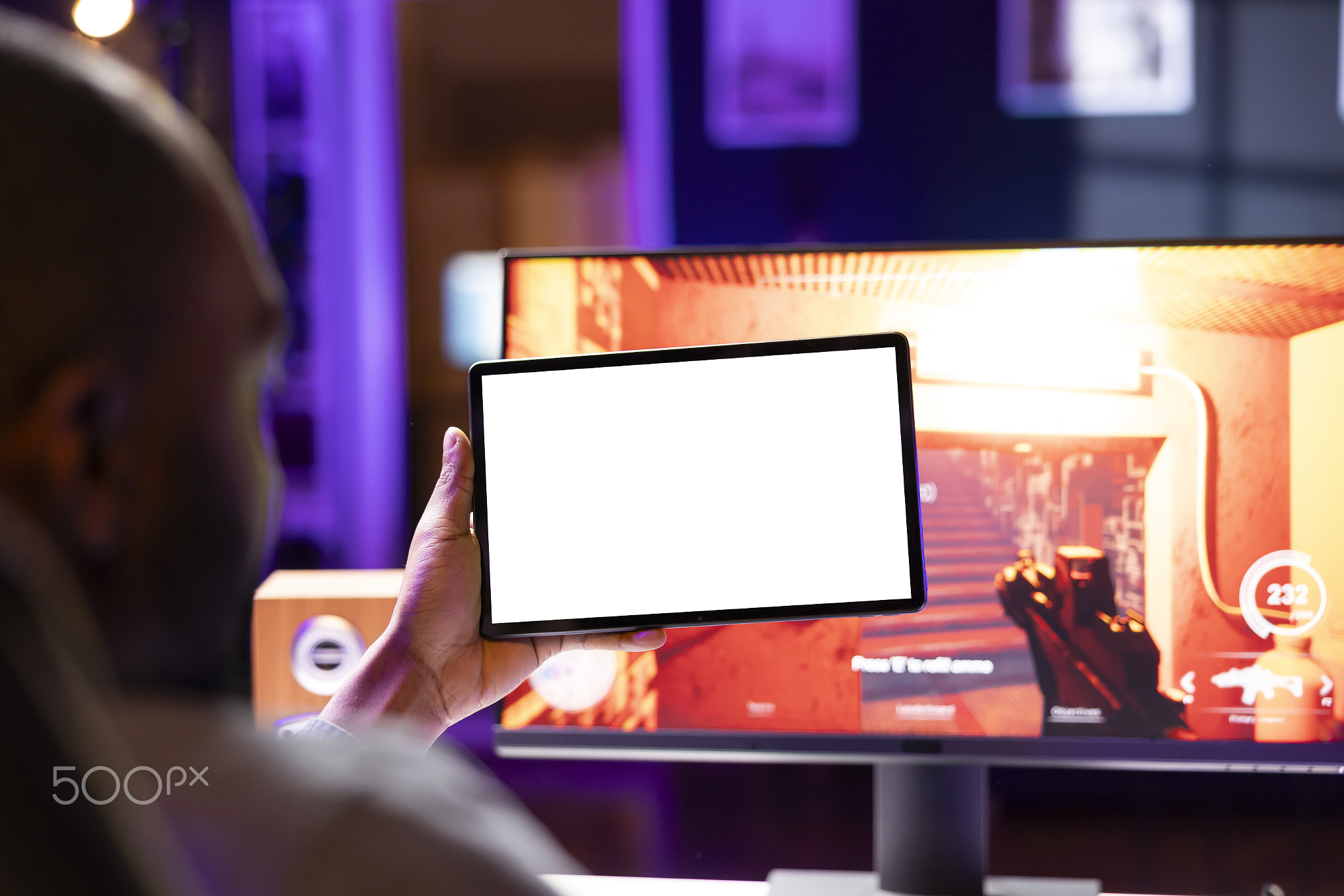 Player looking at isolated screen tablet, taking break from playing
