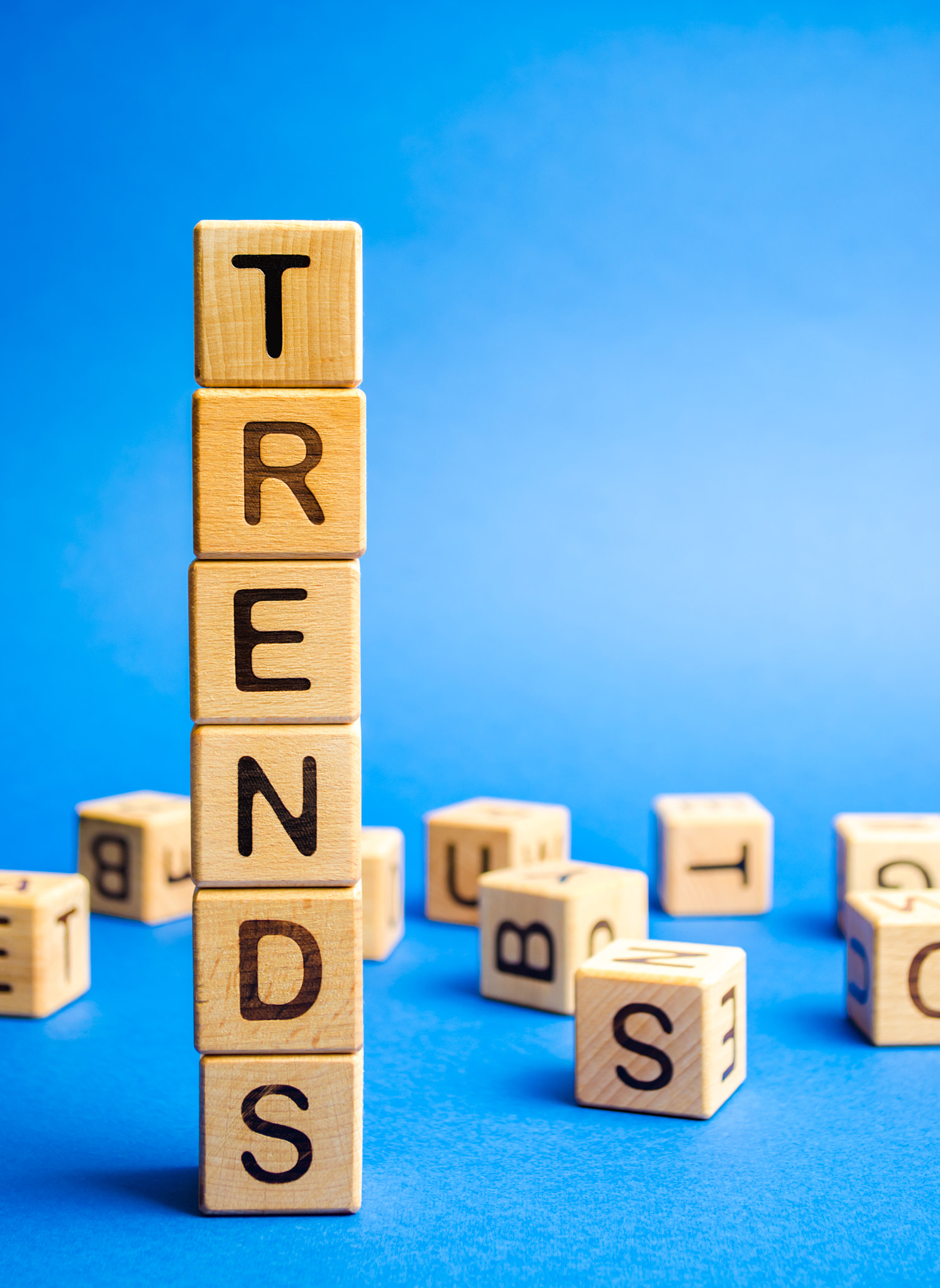 Wooden blocks with the word Trends. Popular and relevant topics. New ideological trends. Recent and