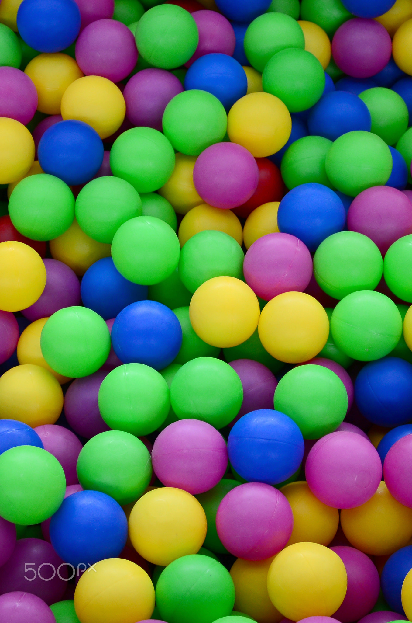 Swimming pool for fun and jumping in colored plastic balls