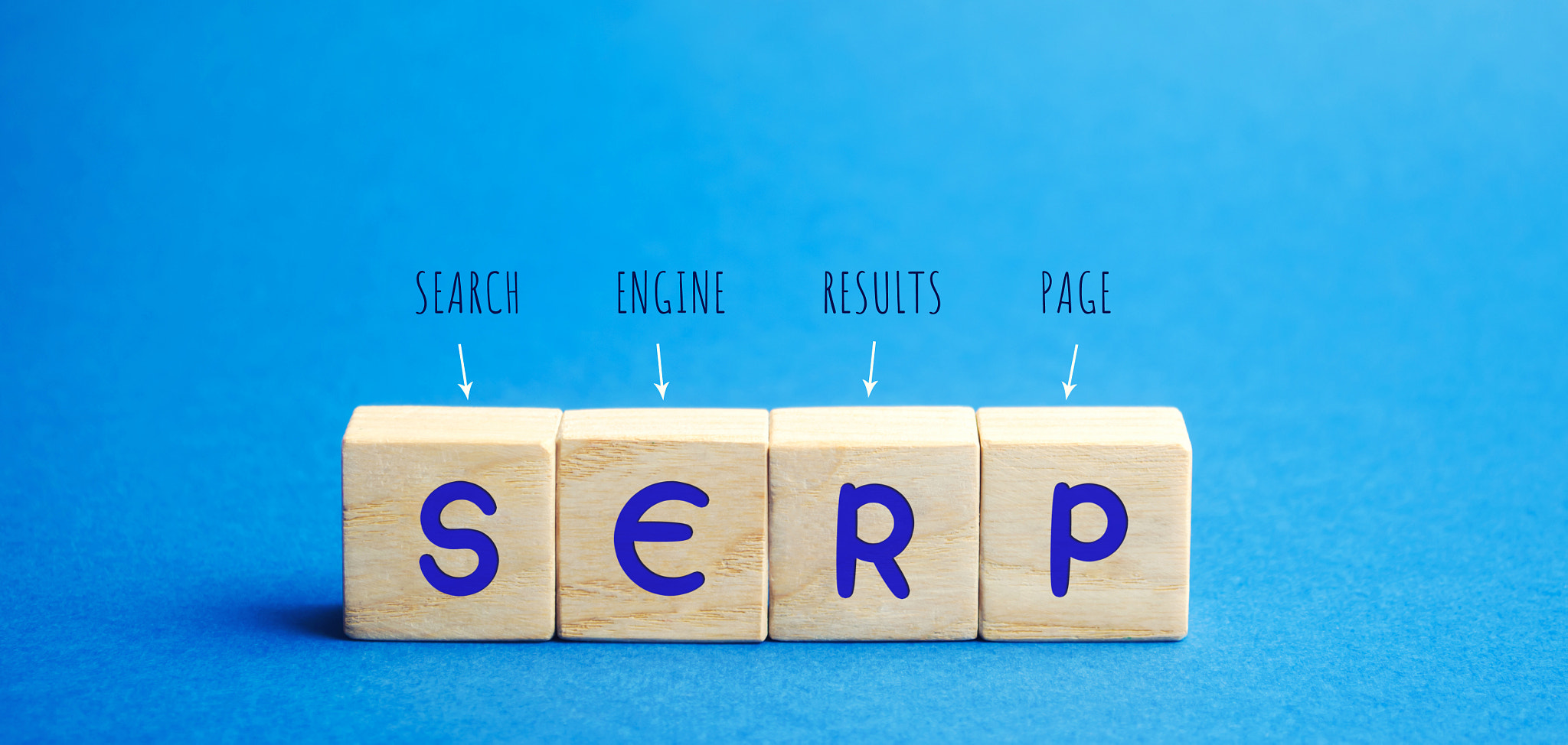 Wooden blocks with the word SERP - Search Engine Results Page. Pages displayed by search engines in