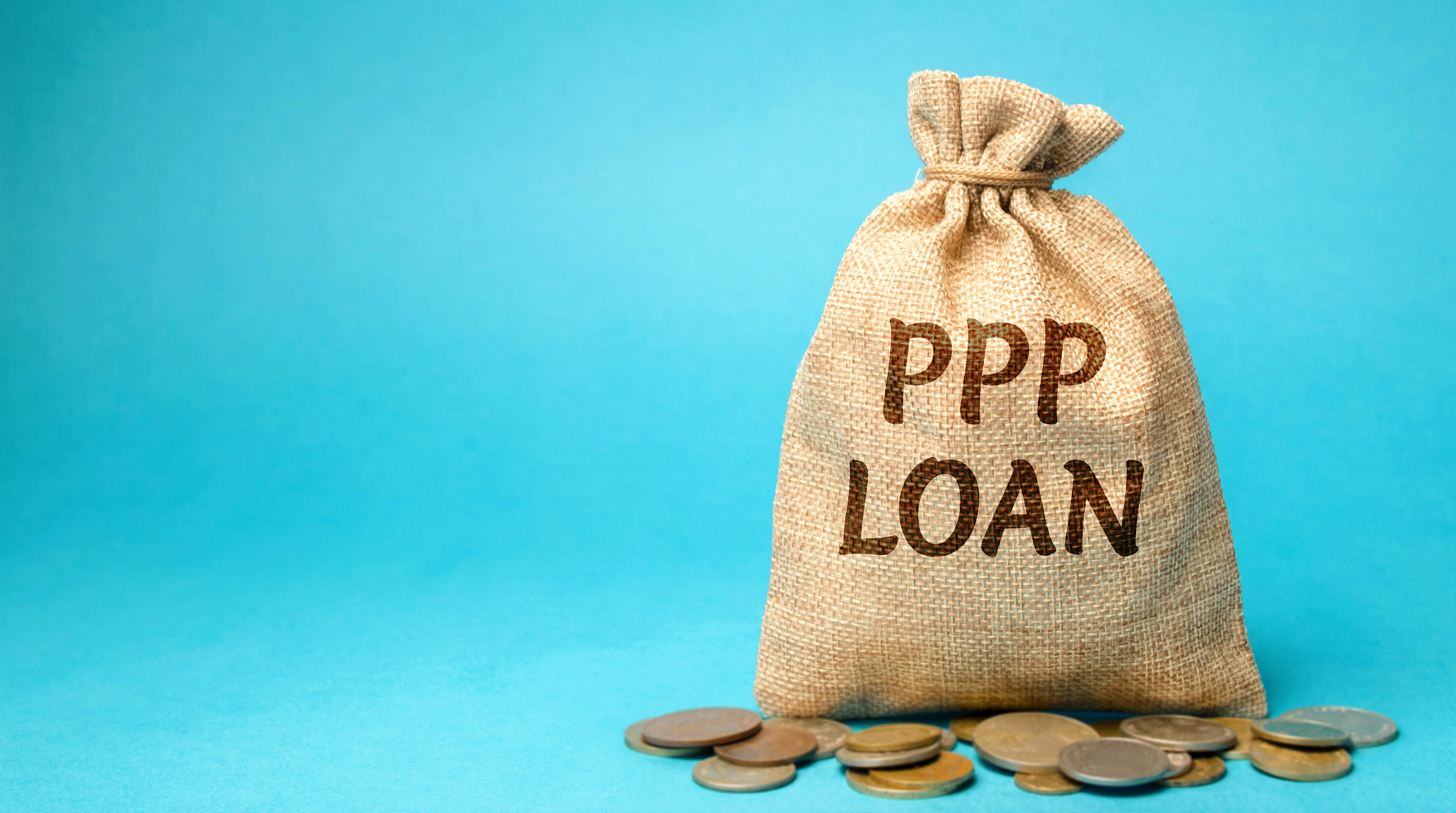 Money bag with the word PPP loan - Paycheck Protection Program. Loan designed to provide a direct in