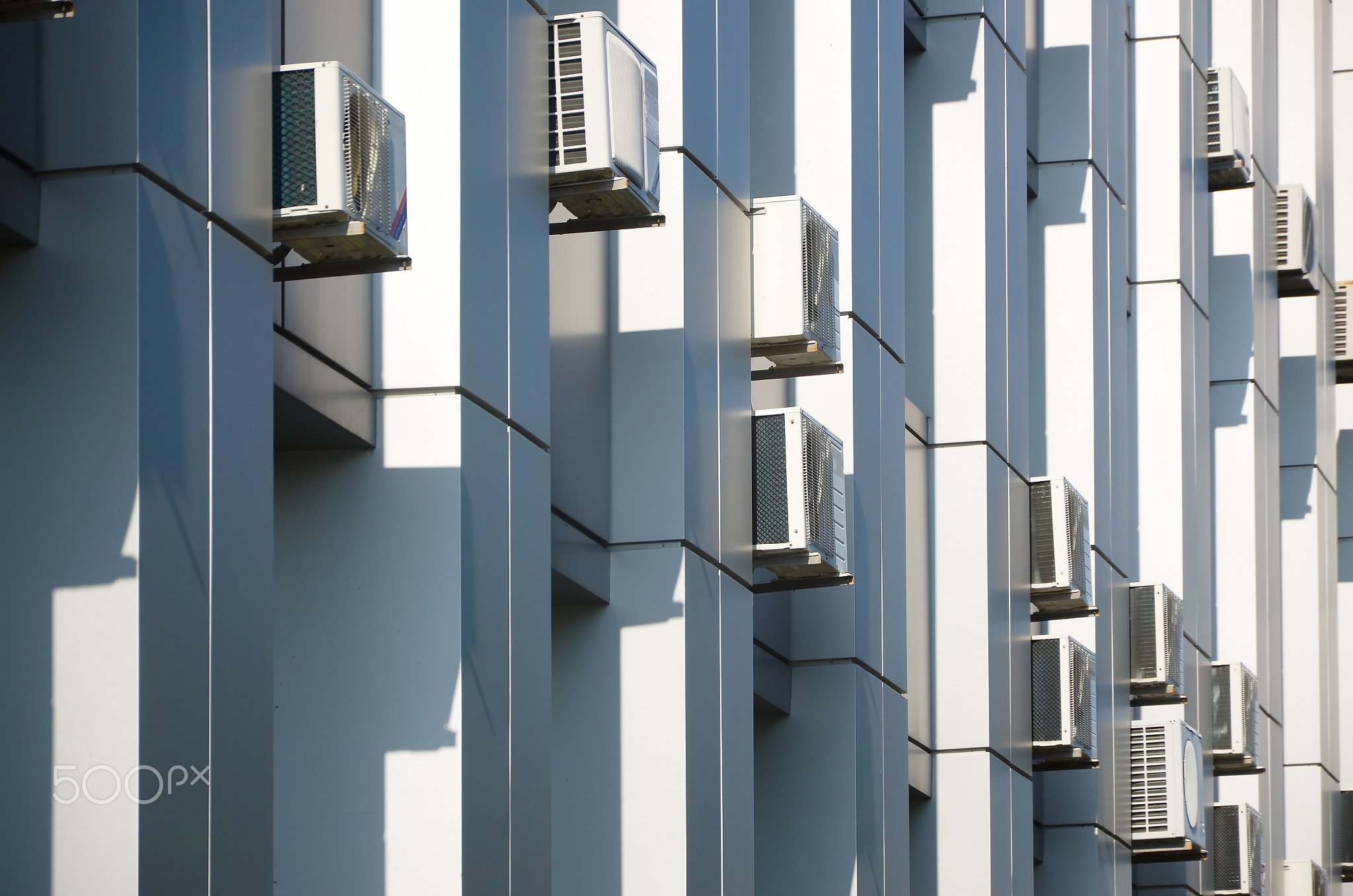 Many HVAC air conditioning and ventilation systems on wall