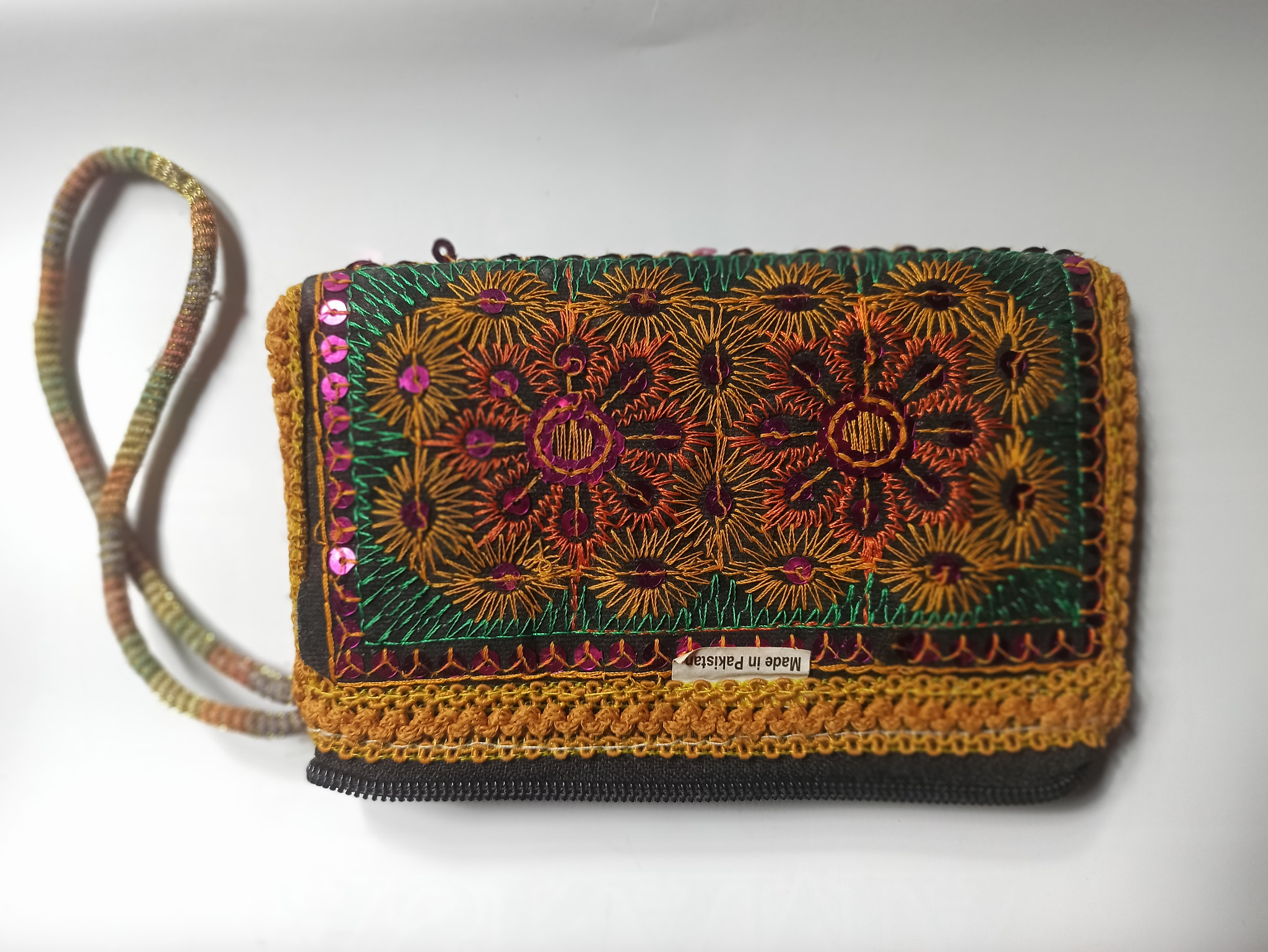 Close-up of purse on white background