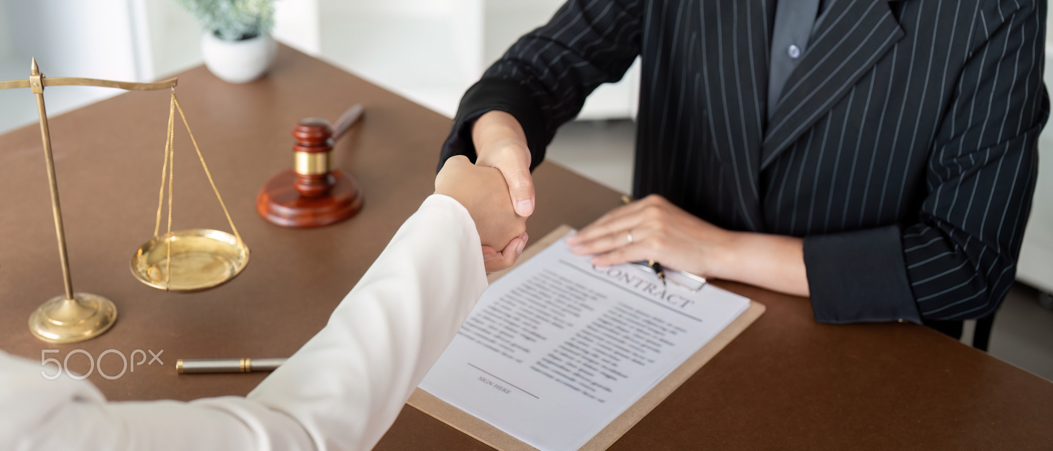 Businesswoman handshake to seal a deal judge female lawyers