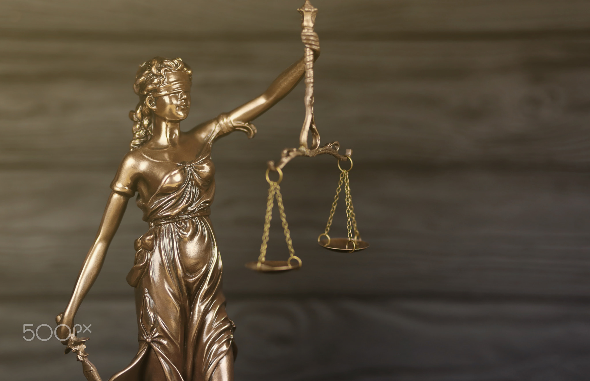The Statue of Justice - lady justice or justitia the Roman goddess of Justice. Statue on black