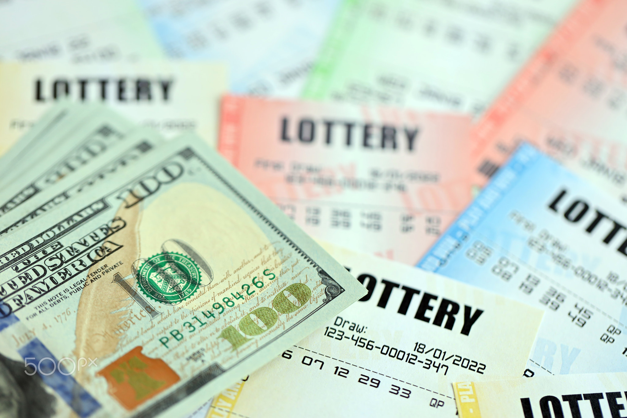 Many lottery tickets and dollar bills on blank bills with numbers for playing lottery