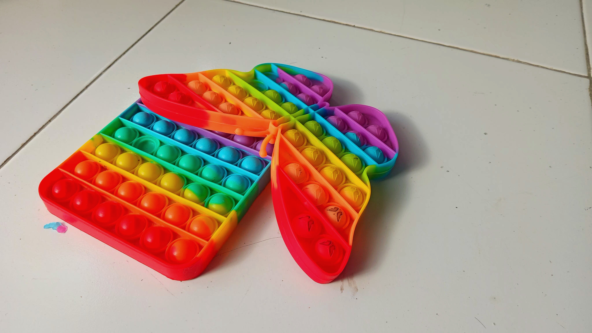 Rainbow colored children's toys on the floor