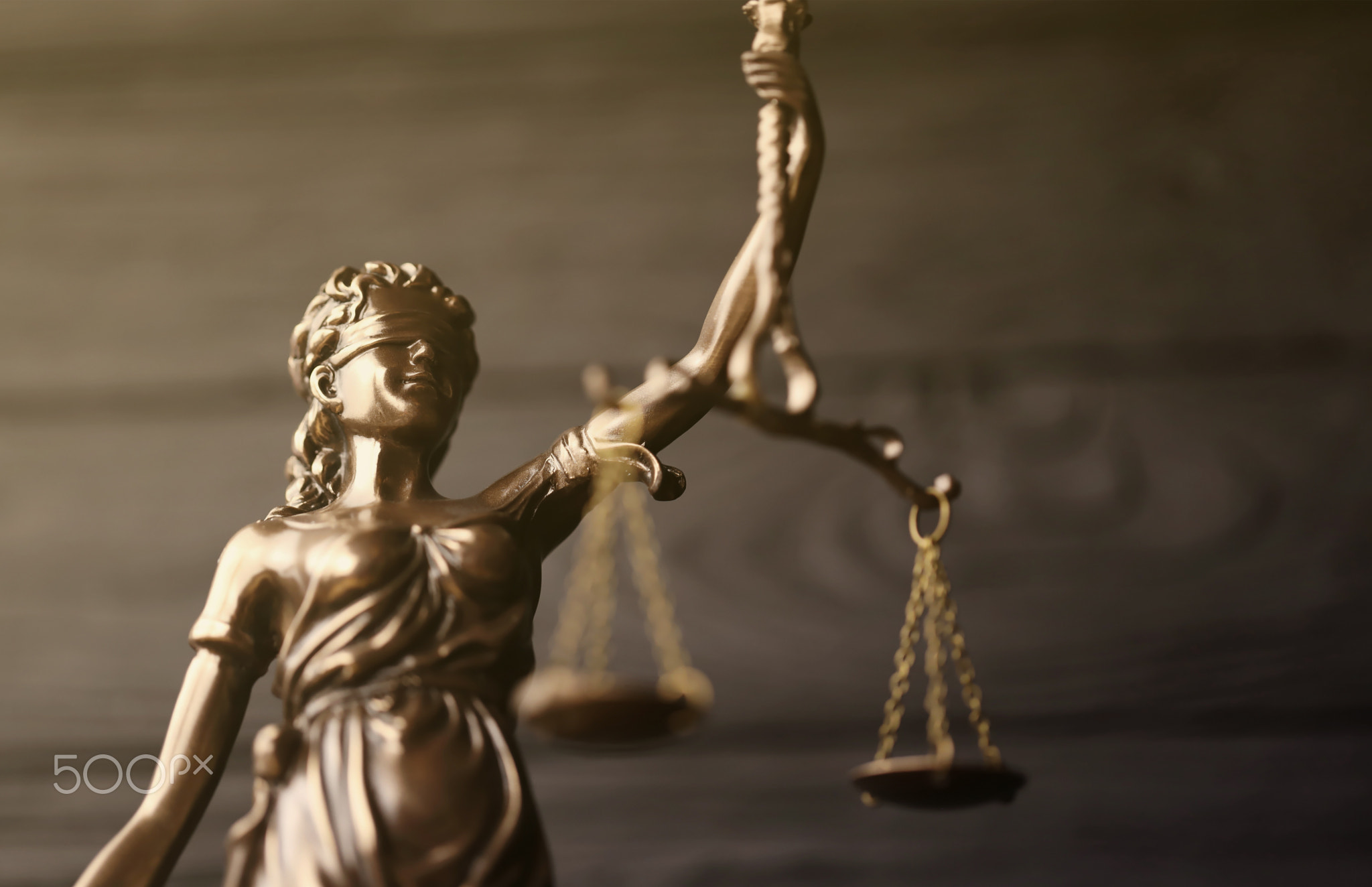 The Statue of Justice - lady justice or justitia the Roman goddess of Justice. Statue on black