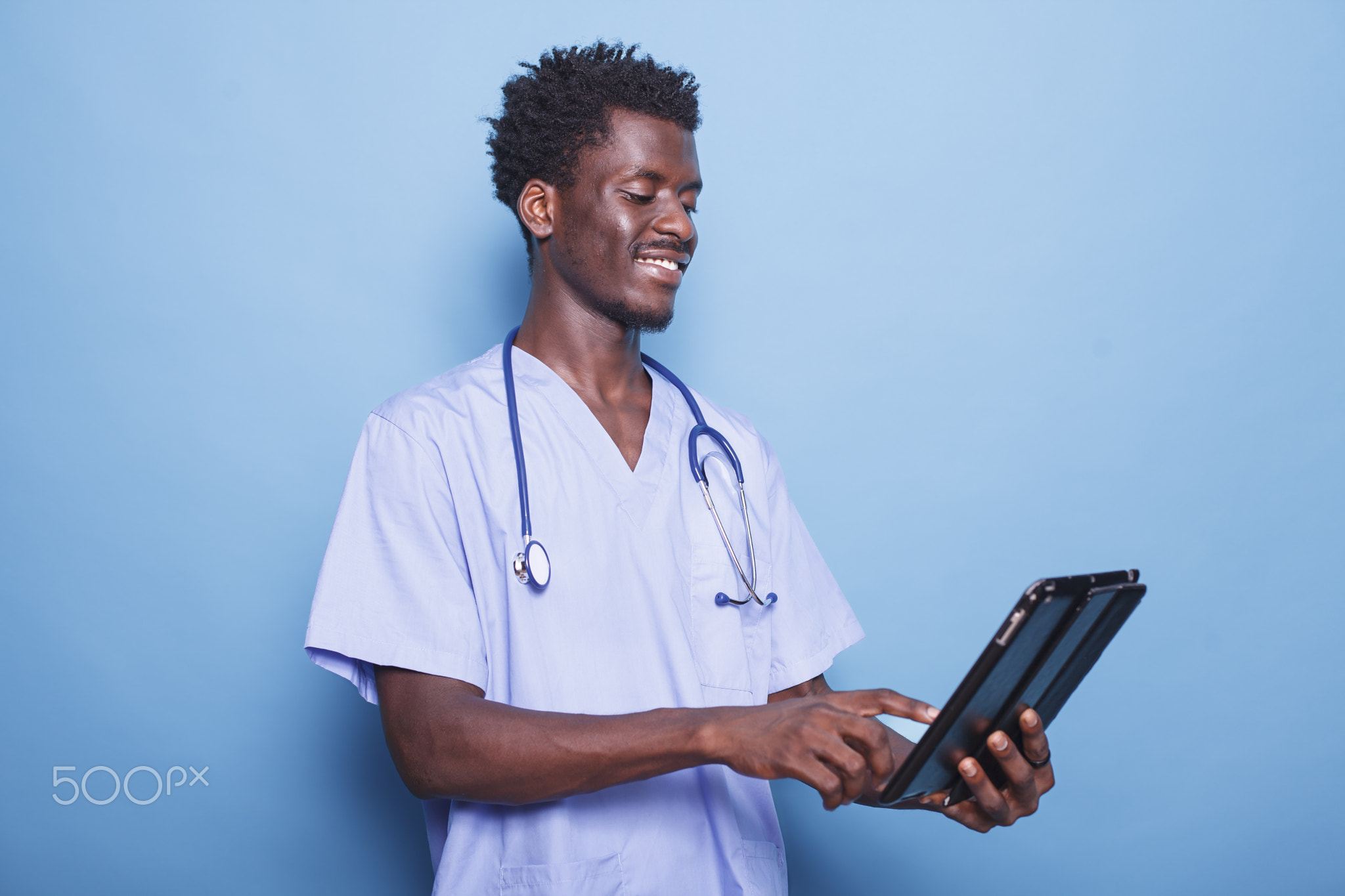 Black doctor with tablet and stethoscope