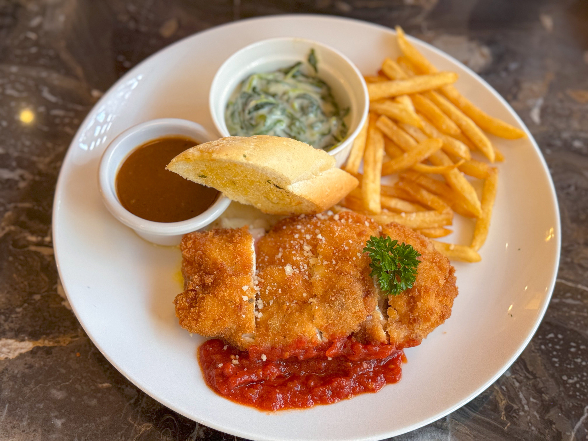 High angle view of chicken cordon bleu in plate on table