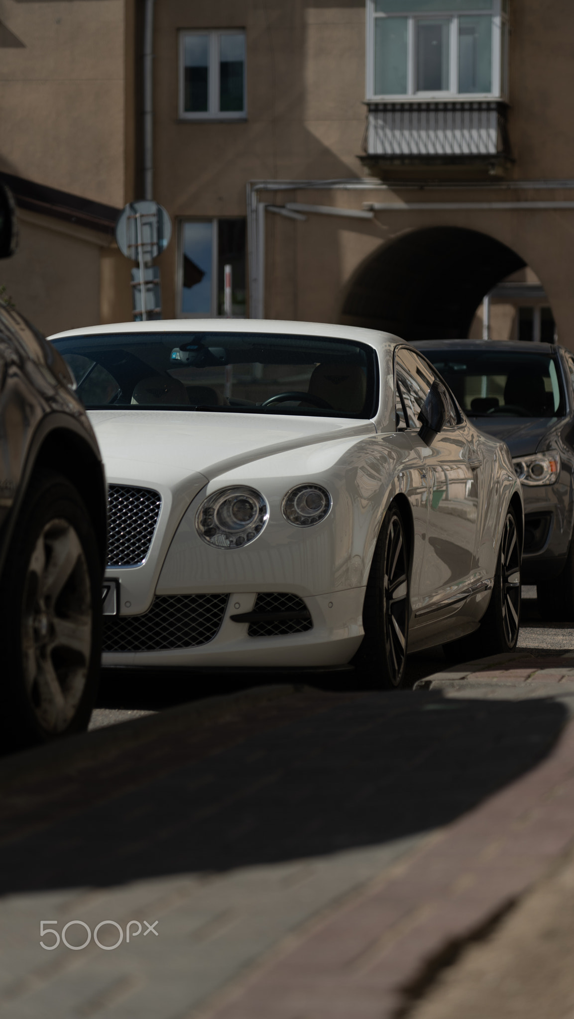 An elegant, luxurious white Bentley car