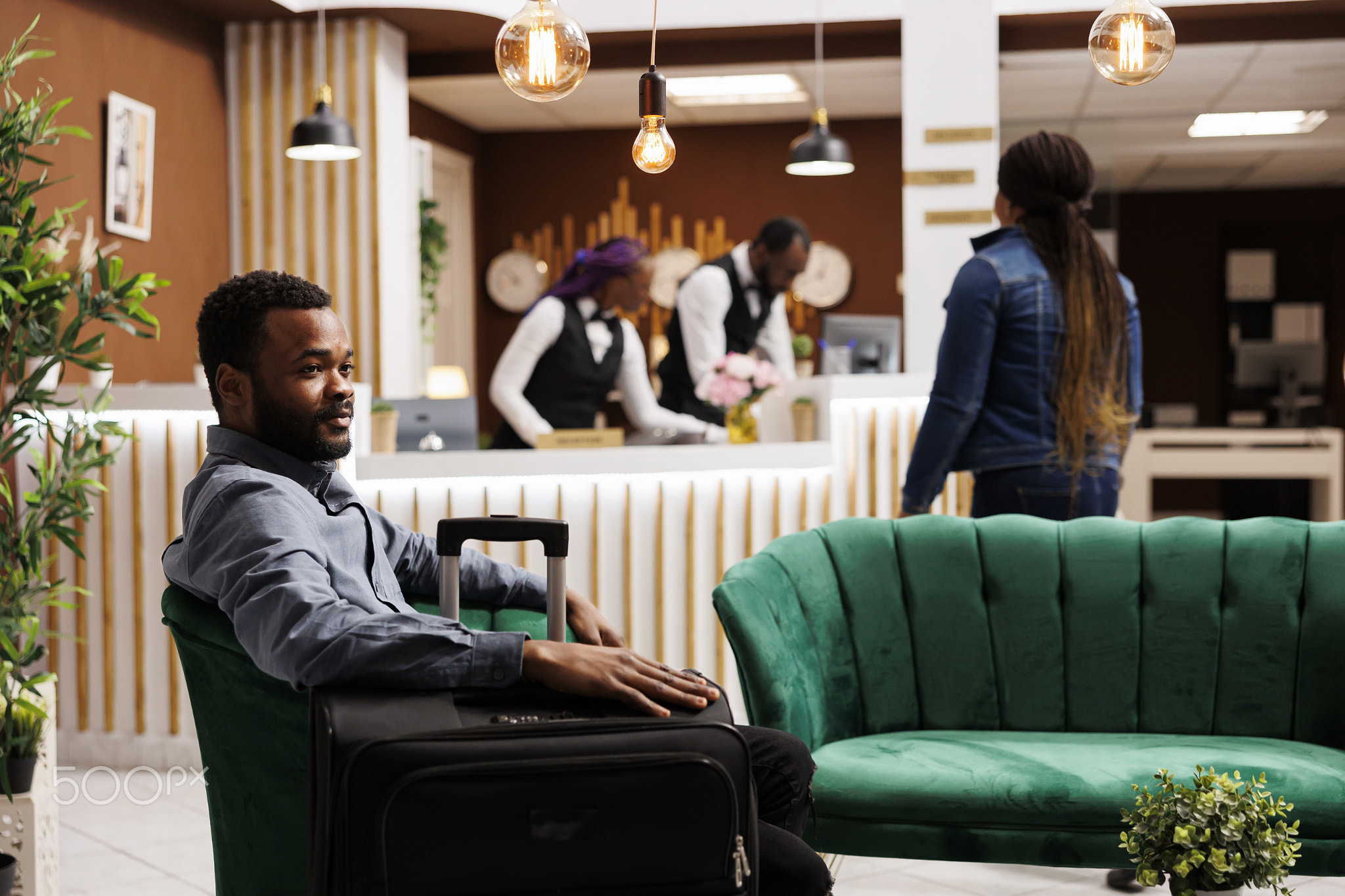 Man traveler waiting for hotel check-in