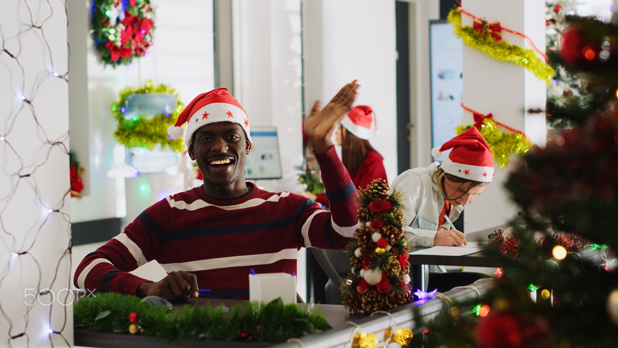 Manager in xmas adorn office doing vlog