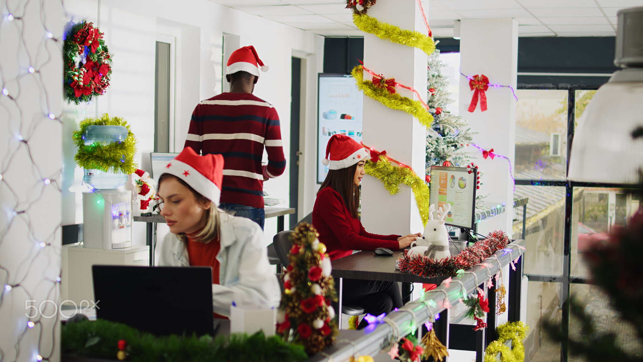 Staff members solve tasks in xmas office