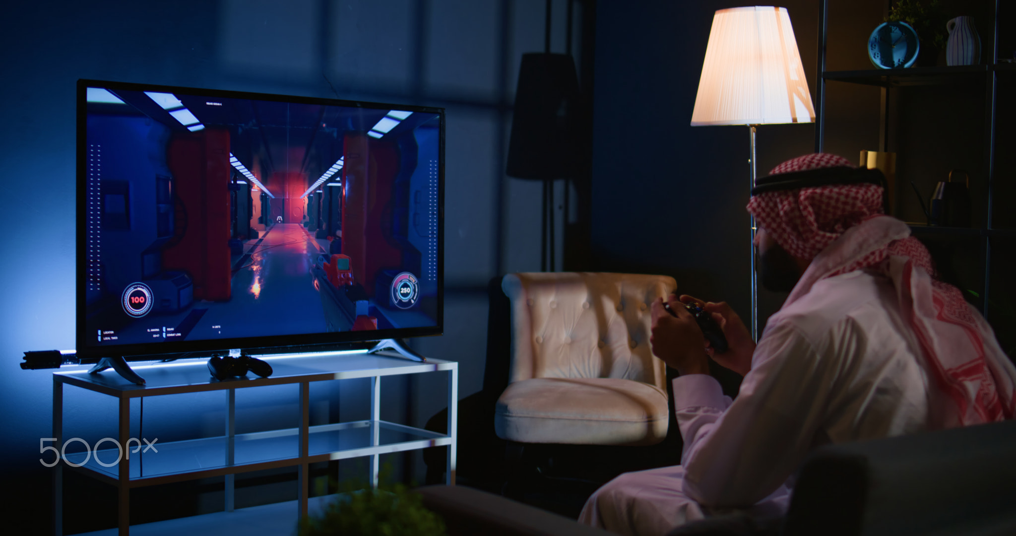 Man in living room playing games on TV