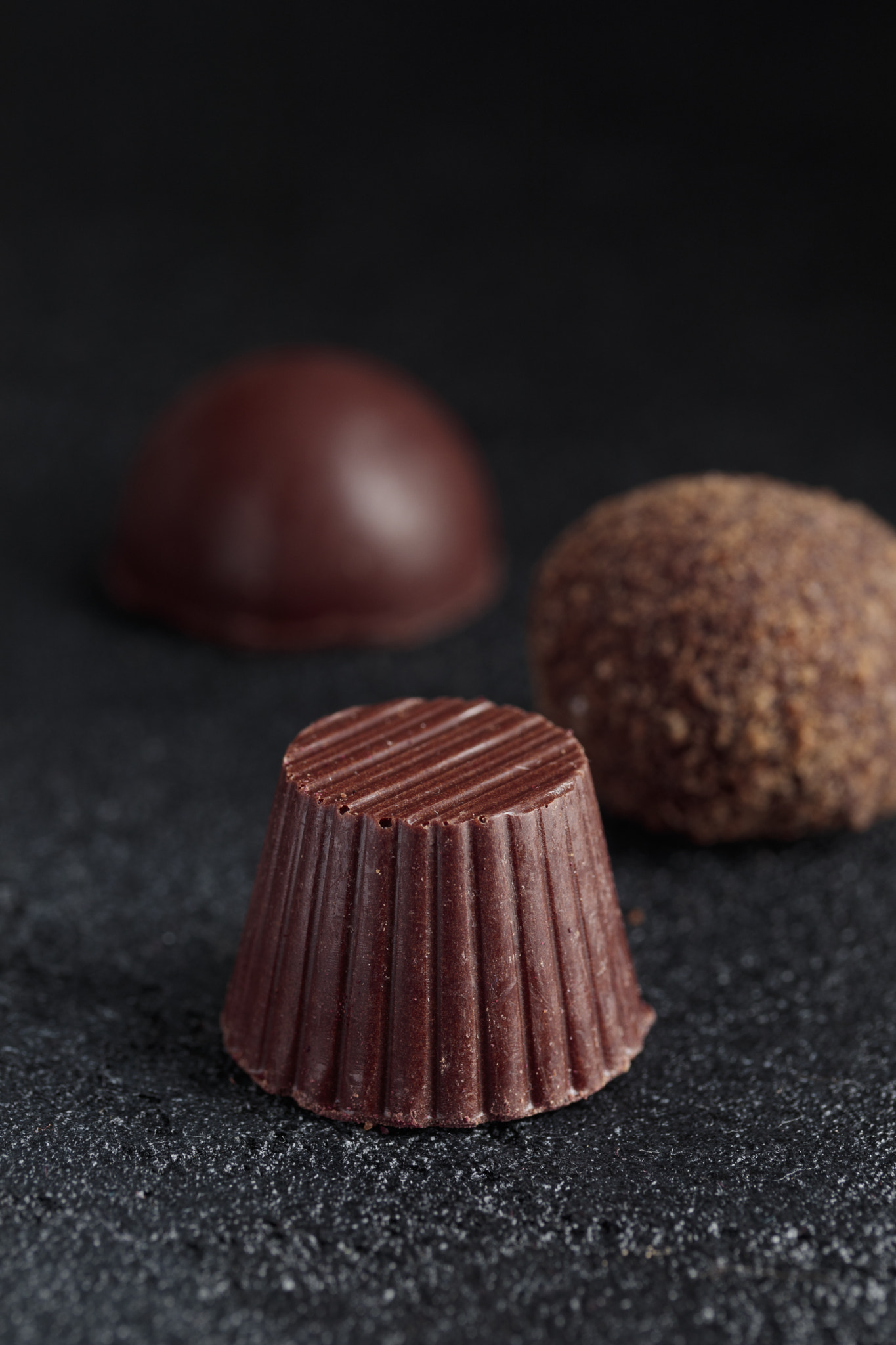 Delicious gourmet chocolate handmade truffles from confectionery, homemade dark chocolate candies on